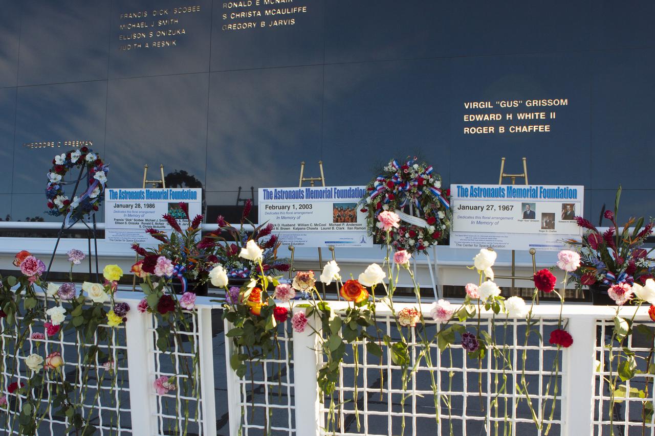CAPE CANAVERAL, Fla. -- Kennedy Space Center Employees and guests placed wreaths and flowers at the Space Mirror Memorial at the spaceport's Visitor Complex during NASA's Day of Remembrance. The annual event took place on the 10th anniversary of the loss of the space shuttle Columbia and its crew and was hosted by the Astronauts Memorial Foundation. The ceremony also honored the astronauts of Apollo 1, who perished in 1967, and the shuttle Challenger, lost in 1986, as well as other astronauts who lost their lives while furthering the cause of exploration and discovery.   Dedicated in 1991, the names of fallen astronauts are emblazoned the monument's 4.5-foot-high-by-50-foot-wide polished black granite surface which reflects the sky and has been designated by Congress as a National Memorial. Photo credit: NASA_Jim Grossmann