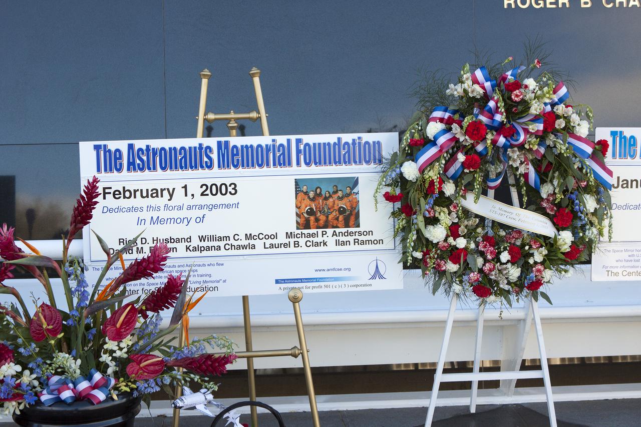 CAPE CANAVERAL, Fla. -- Kennedy Space Center Employees and guests placed wreaths and flowers at the Space Mirror Memorial at the spaceport's Visitor Complex during NASA's Day of Remembrance. The annual event took place on the 10th anniversary of the loss of the space shuttle Columbia and its crew and was hosted by the Astronauts Memorial Foundation. The ceremony also honored the astronauts of Apollo 1, who perished in 1967, and the shuttle Challenger, lost in 1986, as well as other astronauts who lost their lives while furthering the cause of exploration and discovery.   Dedicated in 1991, the names of fallen astronauts are emblazoned the monument's 4.5-foot-high-by-50-foot-wide polished black granite surface which reflects the sky and has been designated by Congress as a National Memorial. Photo credit: NASA_Jim Grossmann