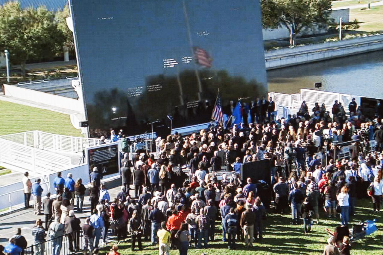 CAPE CANAVERAL, Fla. -- Kennedy Space Center employees and guests stand for the singing of the national anthem by gospel singer BeBe Winans during the Day of Remembrance ceremony at the Kennedy Space Center Visitor Complex. The annual event took place on the 10th anniversary of the loss of the space shuttle Columbia and its crew. Space center Employees and guests gathered at the Space Mirror Memorial at the spaceport's visitor complex for the annual event which took place on the 10th anniversary of the loss of the space shuttle Columbia and its crew.   The ceremony also honored the astronauts of Apollo 1 and the shuttle Challenger. Dedicated in 1991, the names of fallen astronauts are emblazoned the Space Mirror Memorial's 4.5-foot-high-by-50-foot-wide polished black granite surface which reflects the sky and has been designated by Congress as a National Memorial. Image credit: NASA Television