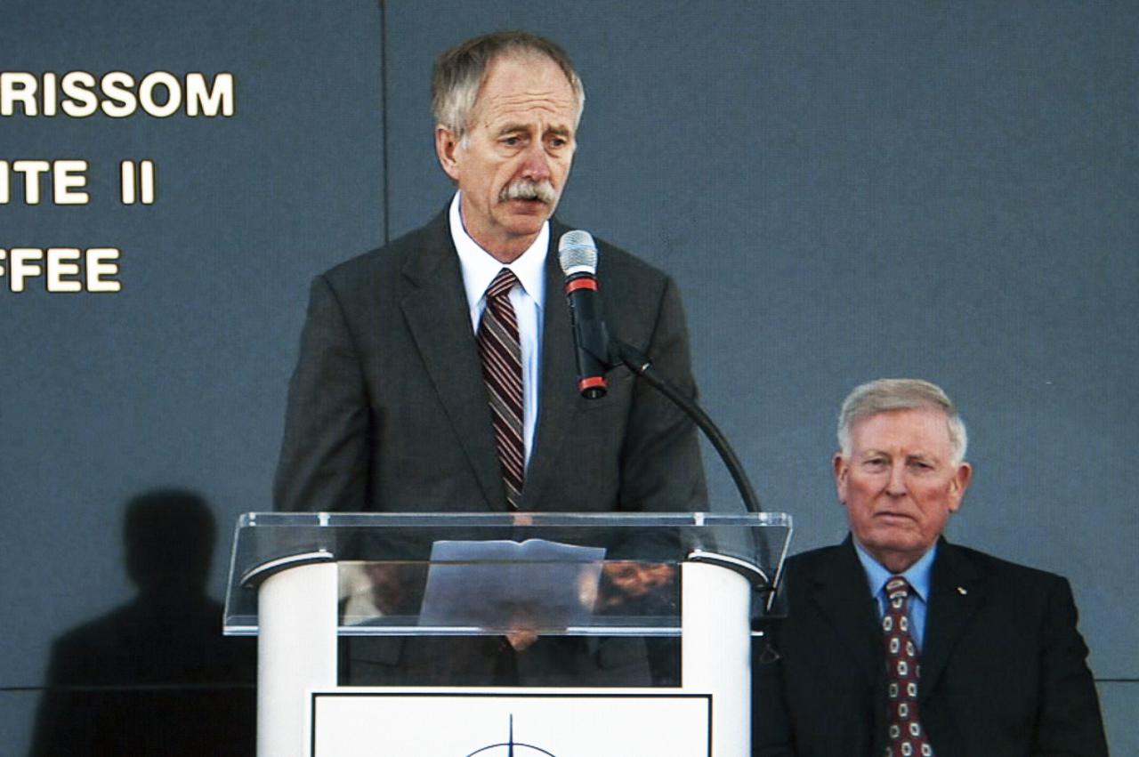 CAPE CANAVERAL, Fla. -- Associate Administrator for Human Exploration and Operations William Gerstenmaier speaks during the Day of Remembrance ceremony. Visible to the right is former NASA astronaut Jon McBride, chairman of the Astronauts Memorial Foundation board of directors. Space center Employees and guests gathered at the Space Mirror Memorial at the visitor complex for the annual event which took place on the 10th anniversary of the loss of the space shuttle Columbia and its crew.   The ceremony also honored the astronauts of Apollo 1 and the shuttle Challenger. Dedicated in 1991, the names of fallen astronauts are emblazoned the Space Mirror Memorial's 4.5-foot-high-by-50-foot-wide polished black granite surface which reflects the sky and has been designated by Congress as a National Memorial. Image credit: NASA Television