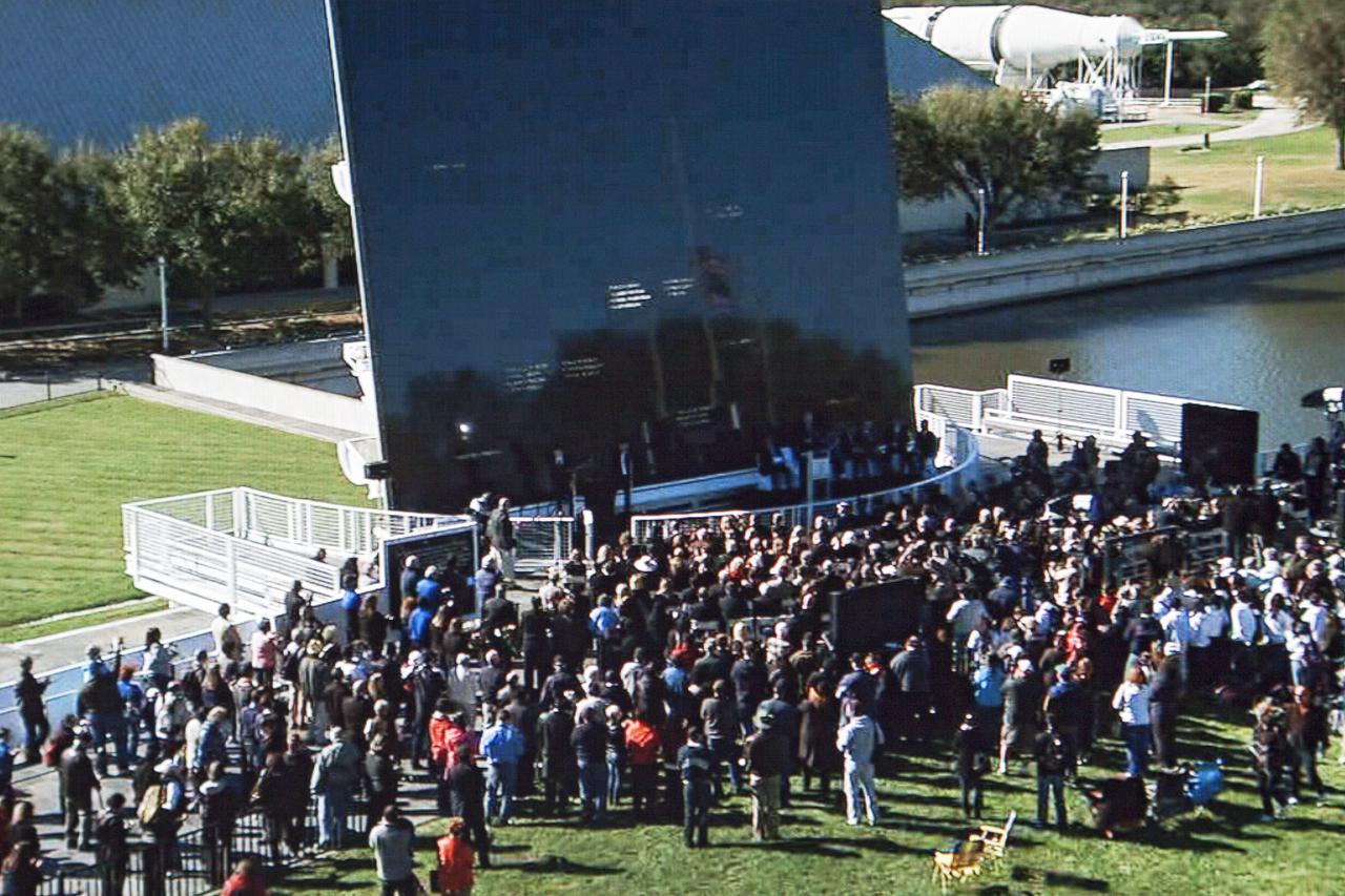CAPE CANAVERAL, Fla. -- Kennedy Space Center employees and guests gathered at the Space Mirror Memorial at the Kennedy Space Center's Visitor Complex for the annual event which took place on the 10th anniversary of the loss of the space shuttle Columbia and its crew.    The ceremony also honored the astronauts of Apollo 1 and the shuttle Challenger. Dedicated in 1991, the names of fallen astronauts are emblazoned the Space Mirror Memorial's 4.5-foot-high-by-50-foot-wide polished black granite surface which reflects the sky and has been designated by Congress as a National Memorial. Image credit: NASA Television