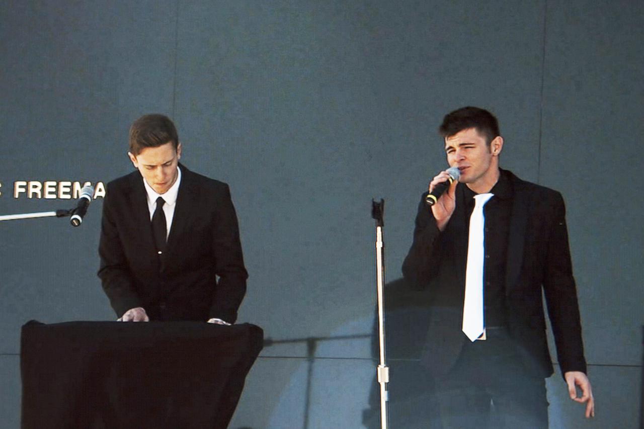CAPE CANAVERAL, Fla. -- Kyle Breese, playing keyboard, and Joey Beesley, singing, performed the song '16 minutes from home' during the Kennedy Space Center's Day of Remembrance ceremony. Written by Breese, the song honors the Columbia astronauts who were 16 minutes away from landing when their spacecraft broke up during re-entry 10 years ago. Space center employees and guests gathered at the Space Mirror Memorial at the visitor complex for the annual event which took place on the 10th anniversary of the loss of the space shuttle Columbia and its crew.   The ceremony also honored the astronauts of Apollo 1 and the shuttle Challenger. Dedicated in 1991, the names of fallen astronauts are emblazoned the Space Mirror Memorial's 4.5-foot-high-by-50-foot-wide polished black granite surface which reflects the sky and has been designated by Congress as a National Memorial. Image credit: NASA Television