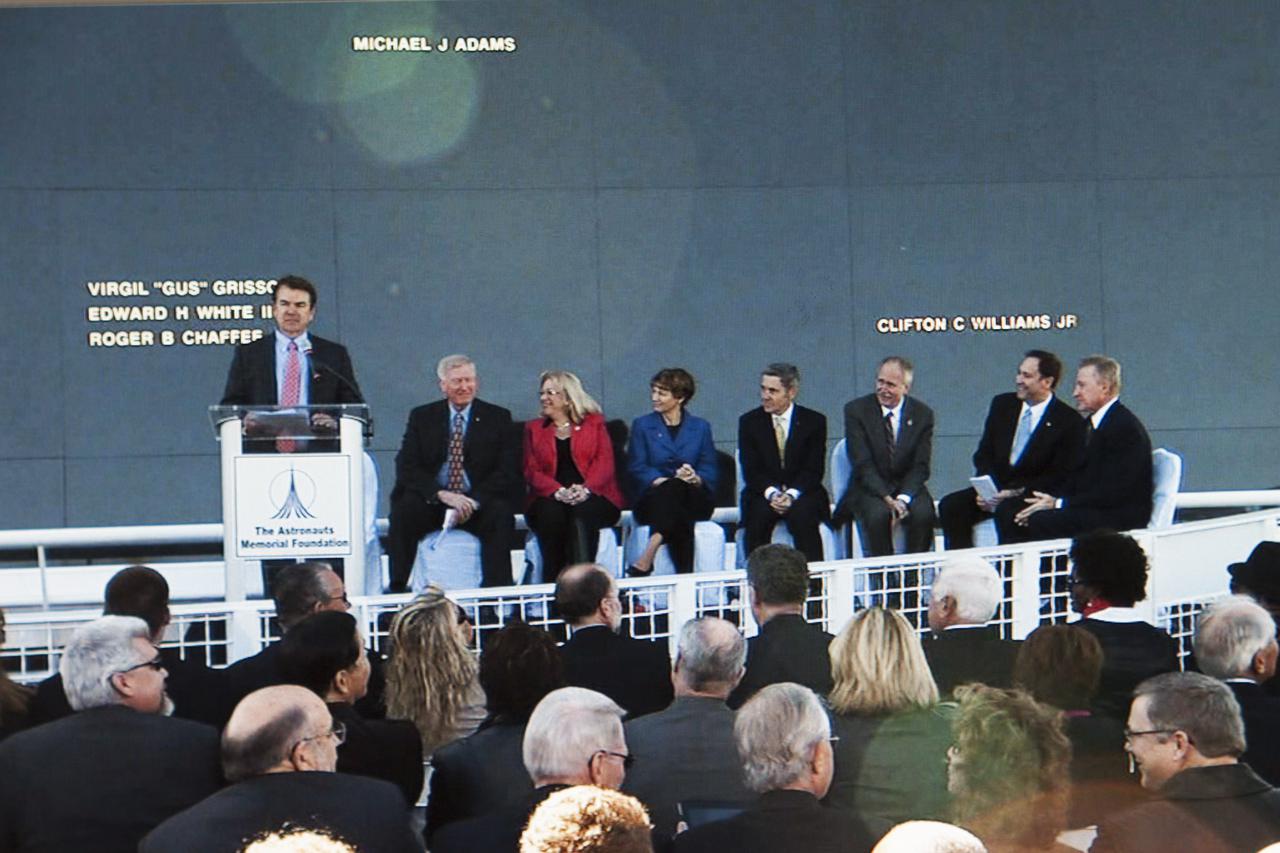 CAPE CANAVERAL, Fla. -- State Sen. Thad Altman, president and chief executive officer of the Astronauts Memorial Foundation speaks during the Day of Remembrance ceremony. Seated to the right are, from the left, former NASA astronaut Jon McBride, chairman of the Astronauts Memorial Foundation board of directors Evelyn Husband-Thompson, widow of STS-107 commander Rick Husband Eileen Collins, commander of Discovery on the STS-114 mission that returned the shuttle program to flight following STS-107 Kennedy Space Center director Bob Cabana Associate Administrator for Human Exploration and Operations William Gerstenmaier NASA Associate Administrator Robert Lightfoot and Mick Ukleja, chairman of the AMF board of trustees. Space center Employees and guests gathered at the Space Mirror Memorial at the visitor complex for the annual event which took place on the 10th anniversary of the loss of the space shuttle Columbia and its crew.   The ceremony also honored the astronauts of Apollo 1 and the shuttle Challenger. Dedicated in 1991, the names of fallen astronauts are emblazoned the Space Mirror Memorial's 4.5-foot-high-by-50-foot-wide polished black granite surface which reflects the sky and has been designated by Congress as a National Memorial. Image credit: NASA Television
