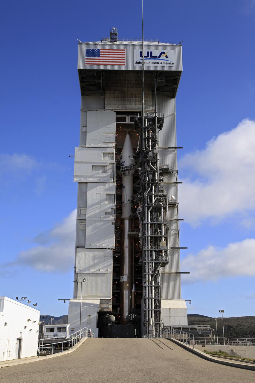 VANDENBERG AFB, Calif. -- At Vandenberg Air Force Base, Calif., NASA's Landsat Data Continuity Mission, or LDCM, satellite is mounted atop a United Launch Alliance Atlas V rocket in the gantry at Space Launch Complex 3E.   The Landsat Data Continuity Mission LDCM is the future of Landsat satellites. It will continue to obtain valuable data and imagery to be used in agriculture, education, business, science, and government. The Landsat Program provides repetitive acquisition of high resolution multispectral data of the Earth's surface on a global basis. The data from the Landsat spacecraft constitute the longest record of the Earth's continental surfaces as seen from space. It is a record unmatched in quality, detail, coverage, and value. Liftoff is planned for Feb. 11, 2013 aboard a United Launch Alliance Atlas V rocket. For more information, visit: http:__www.nasa.gov_mission_pages_landsat_main_index.html Photo credit: NASA_Kim Shiflett