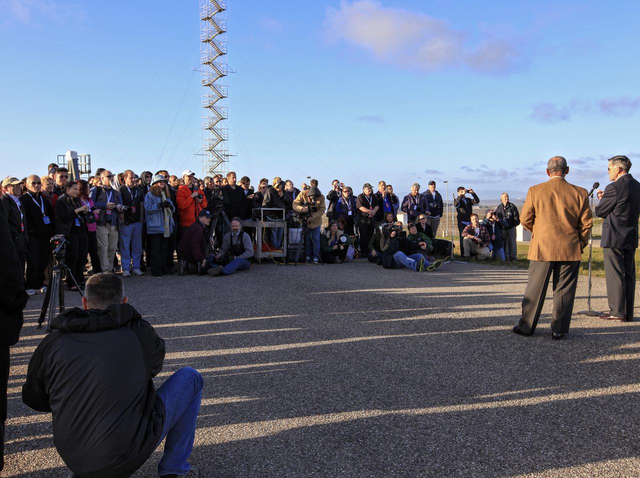 VANDENBERG AFB, Calif. -- At Space Launch Complex 3E at Vandenberg Air Force Base, Calif., NASA Administrator Charles Bolden, left, and Kennedy Space Center Director Bob Cabana, discuss the Landsat Data Continuity Mission, or LDCM, satellite mission with NASA social media followers. The Landsat Data Continuity Mission LDCM is the future of Landsat satellites. It will continue to obtain valuable data and imagery to be used in agriculture, education, business, science, and government. The Landsat Program provides repetitive acquisition of high resolution multispectral data of the Earth's surface on a global basis. The data from the Landsat spacecraft constitute the longest record of the Earth's continental surfaces as seen from space. It is a record unmatched in quality, detail, coverage, and value. Liftoff is planned for Feb. 11, 2013 aboard a United Launch Alliance Atlas V rocket. For more information, visit: http:__www.nasa.gov_mission_pages_landsat_main_index.html Photo credit: NASA_Kim Shiflett