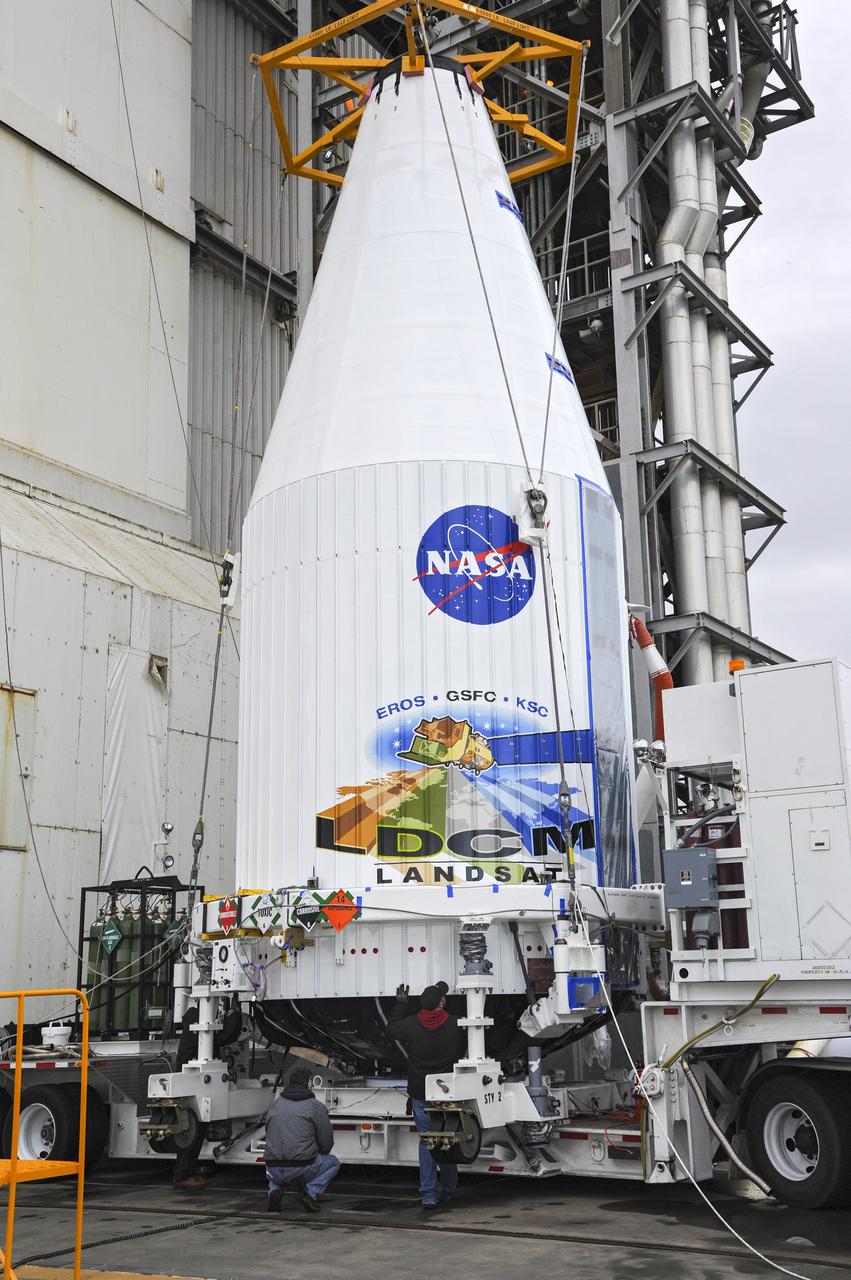 VANDENBERG AFB, Calif. -- The payload fairing containing the Landsat Data Continuity Mission, or LDCM, spacecraft is about to be hoisted atop a United Launch Alliance Atlas V rocket at Space Launch Complex-3E at Vandenberg Air Force Base, Calif.   The Landsat Data Continuity Mission LDCM is the future of Landsat satellites. It will continue to obtain valuable data and imagery to be used in agriculture, education, business, science, and government. The Landsat Program provides repetitive acquisition of high resolution multispectral data of the Earth's surface on a global basis. The data from the Landsat spacecraft constitute the longest record of the Earth's continental surfaces as seen from space. It is a record unmatched in quality, detail, coverage, and value. Liftoff is planned for Feb. 11, 2013 aboard a United Launch Alliance Atlas V rocket. For more information, visit: http:__www.nasa.gov_mission_pages_landsat_main_index.html Photo credit: NASA