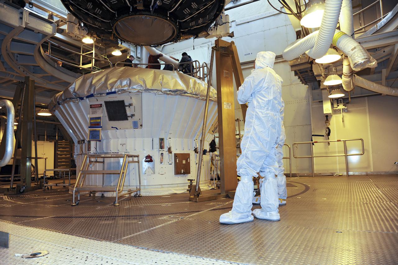 VANDENBERG AFB, Calif. -- Under the watchful eyes of technicians, the payload fairing containing the Landsat Data Continuity Mission, or LDCM, spacecraft has been lifted to the top of Space Launch Complex-3E at Vandenberg Air Force Base, Calif. where it is about to be mounted atop a United Launch Alliance Atlas V rocket.   The Landsat Data Continuity Mission LDCM is the future of Landsat satellites. It will continue to obtain valuable data and imagery to be used in agriculture, education, business, science, and government. The Landsat Program provides repetitive acquisition of high resolution multispectral data of the Earth's surface on a global basis. The data from the Landsat spacecraft constitute the longest record of the Earth's continental surfaces as seen from space. It is a record unmatched in quality, detail, coverage, and value. Liftoff is planned for Feb. 11, 2013 aboard a United Launch Alliance Atlas V rocket. For more information, visit: http:__www.nasa.gov_mission_pages_landsat_main_index.html Photo credit: NASA
