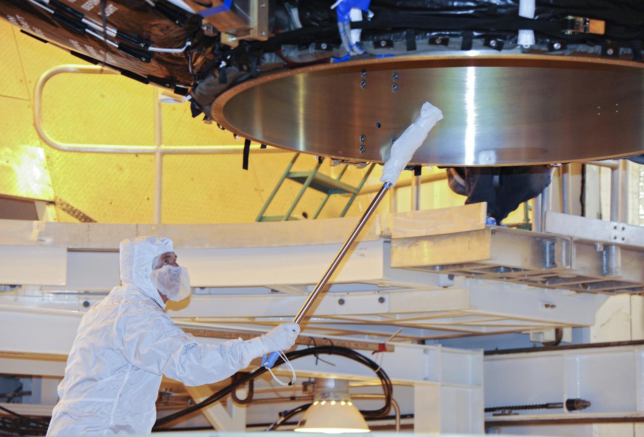 VANDENBERG AFB, Calif. -- A technician ensures no contaminants on the payload fairing or the Landsat Data Continuity Mission, or LDCM, spacecraft about to be mounted atop a United Launch Alliance Atlas V rocket at Space Launch Complex-3E at Vandenberg Air Force Base, Calif.   The Landsat Data Continuity Mission LDCM is the future of Landsat satellites. It will continue to obtain valuable data and imagery to be used in agriculture, education, business, science, and government. The Landsat Program provides repetitive acquisition of high resolution multispectral data of the Earth's surface on a global basis. The data from the Landsat spacecraft constitute the longest record of the Earth's continental surfaces as seen from space. It is a record unmatched in quality, detail, coverage, and value. Liftoff is planned for Feb. 11, 2013 aboard a United Launch Alliance Atlas V rocket. For more information, visit: http:__www.nasa.gov_mission_pages_landsat_main_index.html Photo credit: NASA