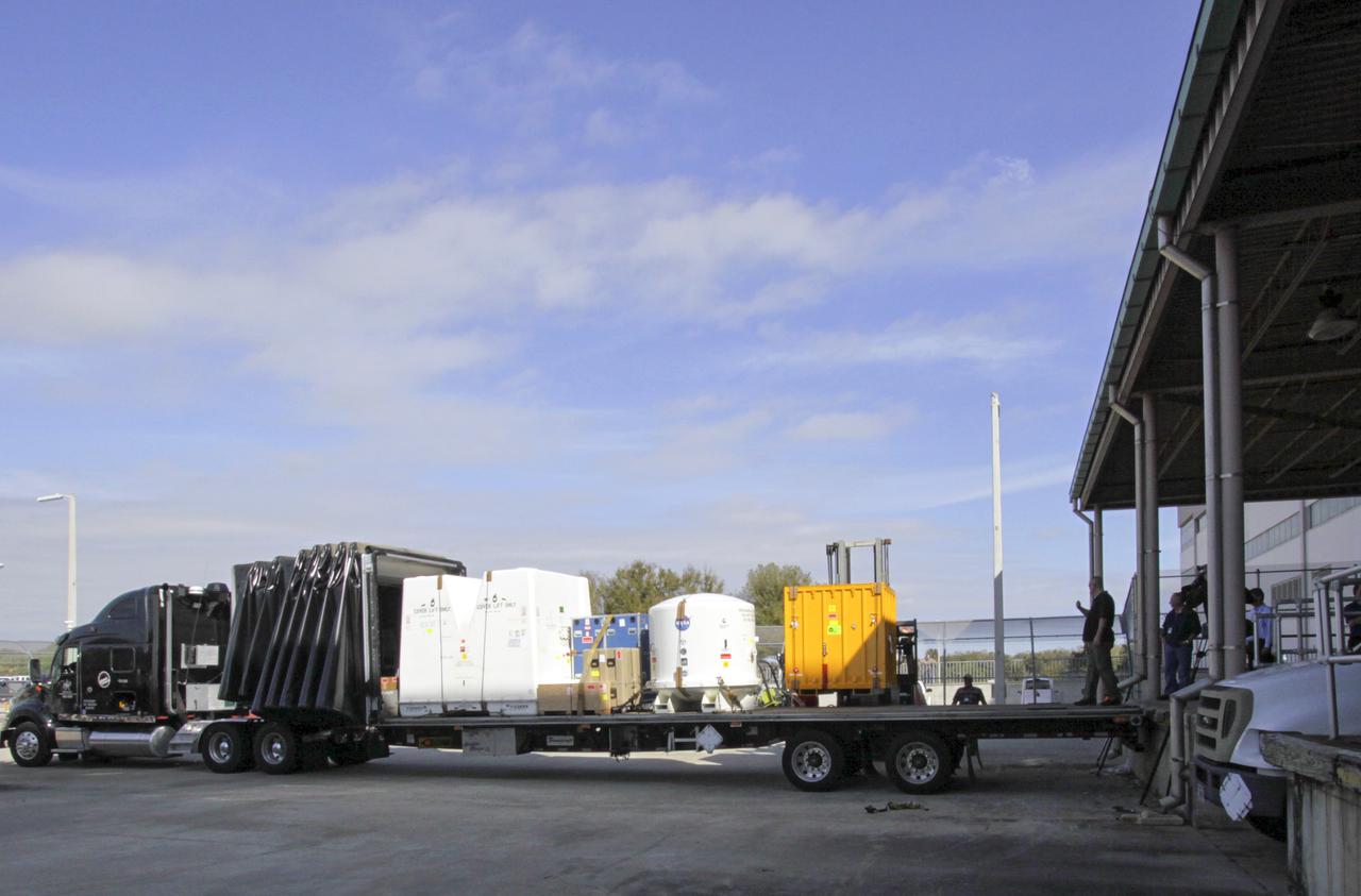CAPE CANAVERAL, Fla. -- Payload shipping containers that hold the unpressurized Orbital Replacement Units ORU for the International Space Station's Main Bus Switching Unit MBSU and Utility Transfer Assembly UTA, as well as the Space Test Program-Houston 4 STP H-4 experiments, are loaded on a transport. The payloads were processed at Kennedy and will be trucked to Chicago. From Chicago, they will be moved by air freight to Narita, Japan, where a complicated combination of ground and ocean ferry transfers will be used to deliver them to the Tanegashima Space Center. At Tanegashima the payloads will be turned over to the Japan Aerospace Exploration Agency JAXA in preparation for launch on the H-II Transfer Vehicle 4 HTV-4 mission this summer. Photo credit: NASA_Jim Grossmann