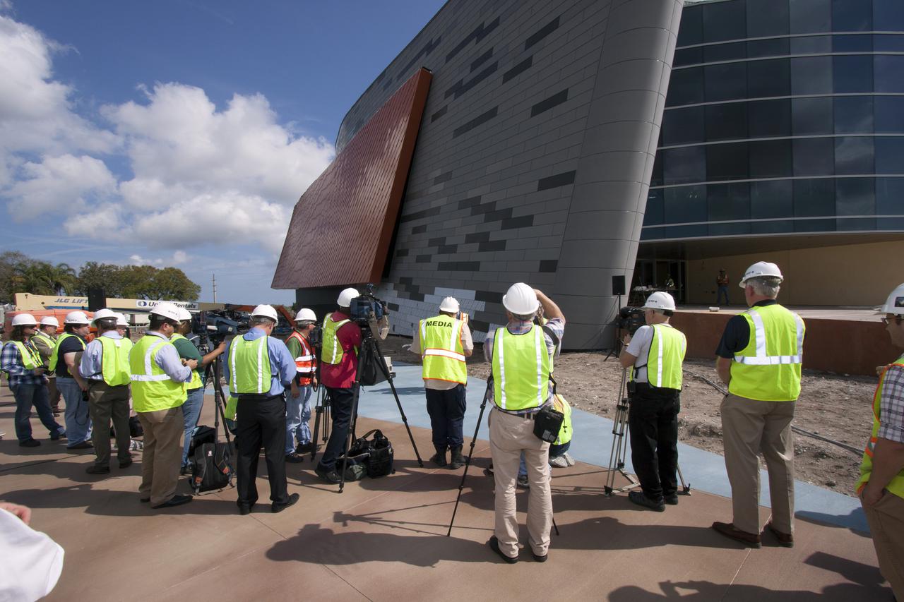 CAPE CANAVERAL, Fla. -- Members of the news media gather at the Kennedy Space Center Visitor Complex for the announcement of the opening date that the facility will officially open and for the unveiling of the exhibit's newly designed logo. The 'Space Shuttle Atlantis' exhibit will open June 29, 2013. Last November, the space shuttle Atlantis made its historic final journey to its new home, traveling 10 miles from the Kennedy Space Center's Vehicle Assembly Building to the spaceport's visitor complex. The new $100 million Atlantis facility will be a 90,000-square-foot, interactive exhibit that tells the story of the 30-year Space Shuttle Program and highlights the future of space exploration. Photo credit: NASA_Jim Grossmann
