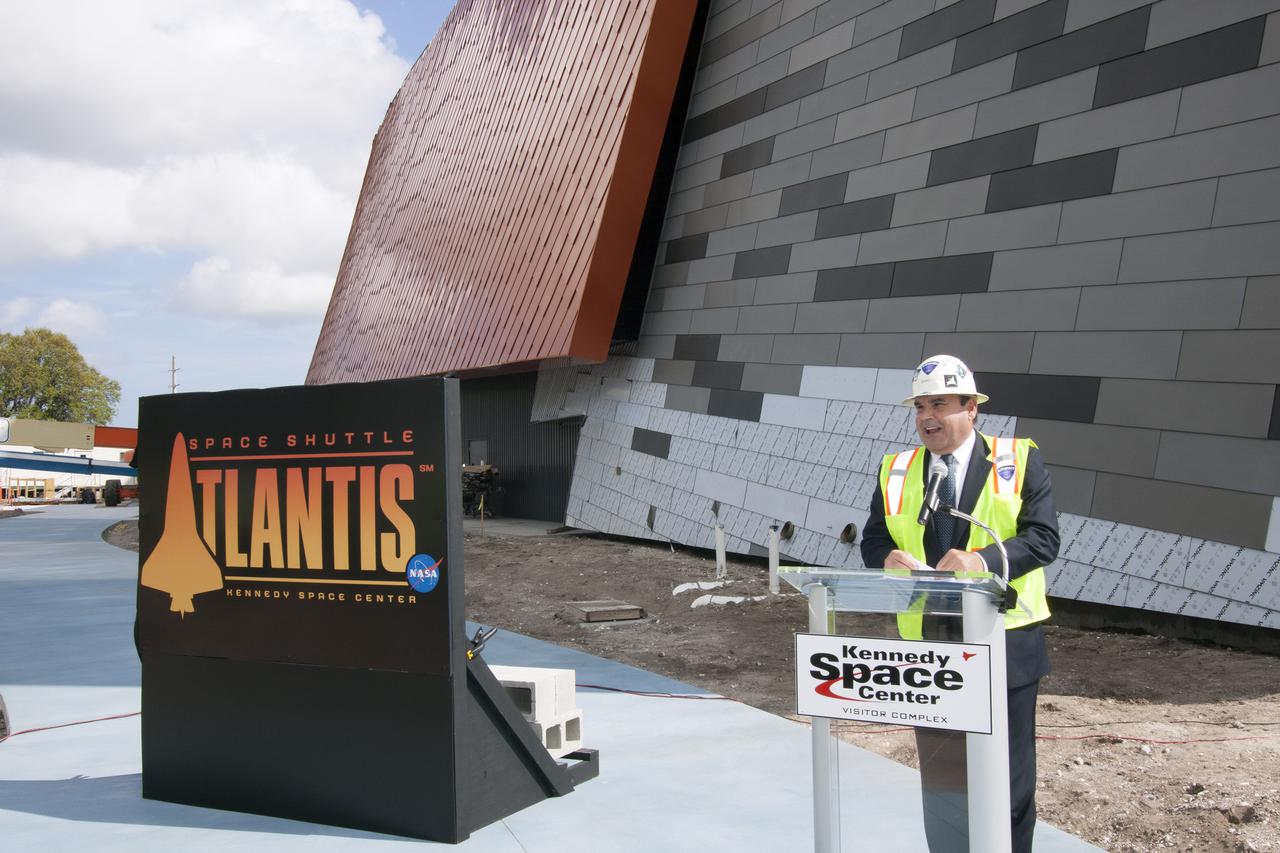 CAPE CANAVERAL, Fla. -- Tim Macy, Delaware North Companies Parks and Resorts director of project development, described the Atlantis exhibit to members of the news media who media gather at the Kennedy Space Center Visitor Complex for the announcement of the opening date of the date the facility will officially open and for the unveiling of the exhibit's newly designed logo.  Last November, the space shuttle Atlantis made its historic final journey to its new home, traveling 10 miles from the Kennedy Space Center's Vehicle Assembly Building to the spaceport's visitor complex. The new $100 million Atlantis facility will be a 90,000-square-foot, interactive exhibit that tells the story of the 30-year Space Shuttle Program and highlights the future of space exploration. Photo credit: NASA_Jim Grossmann