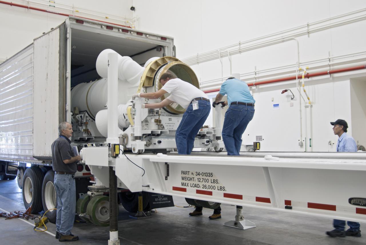 CAPE CANAVERAL, Fla. – At NASA’s Kennedy Space Center in Florida, technicians help remove the Alliant Techsystems, or ATK, launch abort motor from a truck after arrival at the Launch Abort System Facility. The test flight abort motor is for Exploration Flight Test 1, or EFT-1, of the agency’s Orion Multi-Purpose Crew Vehicle. It is part of Orion’s Launch Abort System, which is designed to safely pull the Orion crew module away from the launch vehicle in the event of an emergency on the launch pad or during the initial ascent of NASA’s Space Launch System, or SLS, rocket. The motor is configured with inert propellant.  Orion is the exploration spacecraft designed to carry crews to space beyond low Earth orbit. It will provide emergency abort capability, sustain the crew during the space travel and provide safe re-entry from deep space return velocities. Orion’s first unpiloted test flight is scheduled to launch in 2014 atop a Delta IV rocket. A second uncrewed flight test is scheduled for 2017 on the SLS rocket. For more information, visit http:__www.nasa.gov_orion. Photo credit: NASA_Charisse Nahser