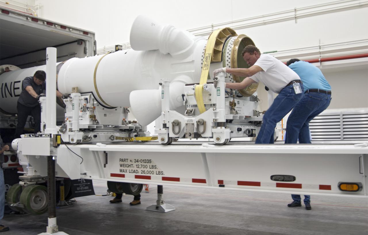 CAPE CANAVERAL, Fla. – At NASA’s Kennedy Space Center in Florida, technicians help remove the Alliant Techsystems, or ATK, launch abort motor from a truck after arrival at the Launch Abort System Facility. The test flight abort motor is for Exploration Flight Test 1, or EFT-1, of the agency’s Orion Multi-Purpose Crew Vehicle. It is part of Orion’s Launch Abort System, which is designed to safely pull the Orion crew module away from the launch vehicle in the event of an emergency on the launch pad or during the initial ascent of NASA’s Space Launch System, or SLS, rocket. The motor is configured with inert propellant.  Orion is the exploration spacecraft designed to carry crews to space beyond low Earth orbit. It will provide emergency abort capability, sustain the crew during the space travel and provide safe re-entry from deep space return velocities. Orion’s first unpiloted test flight is scheduled to launch in 2014 atop a Delta IV rocket. A second uncrewed flight test is scheduled for 2017 on the SLS rocket. For more information, visit http:__www.nasa.gov_orion. Photo credit: NASA_Charisse Nahser