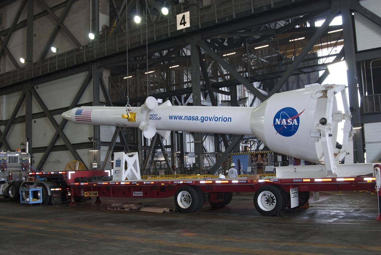 CAPE CANAVERAL, Fla. – A mockup of the Launch Abort System, or LAS, is lifted off a trailer inside the Vehicle Assembly Building at NASA's Kennedy Space Center in Florida so it can be positioned atop a boilerplate Orion capsule during test stacking operations. The Orion spacecraft is being designed to carry astronauts on missions beyond Earth orbit. It will have the LAS during the first part of launch in case an emergency develops that requires the spacecraft to be pulled away from the rocket to save the crew. NASA's Ground Services Development and Operations Program, or GSDO, performed the test operations. Photo credit: NASA_Charisse Nahser