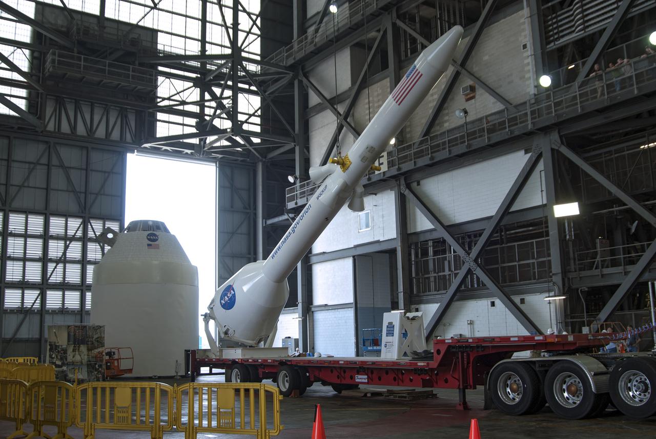 CAPE CANAVERAL, Fla. – A mockup of the Launch Abort System, or LAS, is lifted off a trailer inside the Vehicle Assembly Building at NASA's Kennedy Space Center in Florida so it can be positioned atop a boilerplate Orion capsule during test stacking operations. The Orion spacecraft is being designed to carry astronauts on missions beyond Earth orbit. It will have the LAS during the first part of launch in case an emergency develops that requires the spacecraft to be pulled away from the rocket to save the crew. NASA's Ground Services Development and Operations Program, or GSDO, performed the test operations. Photo credit: NASA_Charisse Nahser