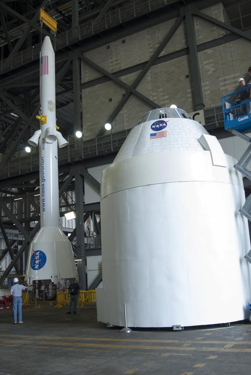 CAPE CANAVERAL, Fla. – A mockup of the Launch Abort System, or LAS, is lifted inside the Vehicle Assembly Building at NASA's Kennedy Space Center in Florida so it can be positioned atop a boilerplate Orion capsule and replica service module during test stacking operations. The Orion spacecraft is being designed to carry astronauts on missions beyond Earth orbit. It will have the LAS during the first part of launch in case an emergency develops that requires the spacecraft to be pulled away from the rocket to save the crew. NASA's Ground Services Development and Operations Program, or GSDO, performed the test operations. Photo credit: NASA_Charisse Nahser