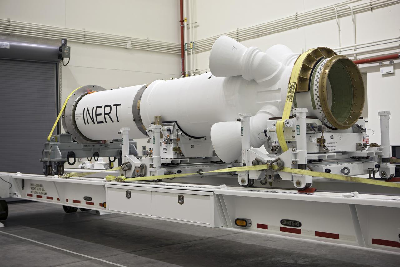 CAPE CANAVERAL, Fla. – At NASA’s Kennedy Space Center in Florida, members of the media viewed the Alliant Techsystems, or ATK, launch abort motor inside the Launch Abort System Facility. ATK’s abort motor is one of the components of Orion’s Launch Abort System, which will be used for Exploration Flight Test 1, or EFT-1. The system is designed to safely pull the Orion crew module away from the launch vehicle in the event of an emergency on the launch pad or during the initial ascent of NASA’s Space Launch System, or SLS, rocket. The test flight abort motor is configured with inert propellant.  Orion is the exploration spacecraft designed to carry crews to space beyond low Earth orbit. It will provide emergency abort capability, sustain the crew during the space travel and provide safe re-entry from deep space return velocities. Orion’s first unpiloted test flight is scheduled to launch in 2014 atop a Delta IV rocket. A second uncrewed flight test is scheduled for 2017 on the SLS rocket. For more information, visit http:__www.nasa.gov_orion. Photo credit: NASA_Dimitri Gerondidakis