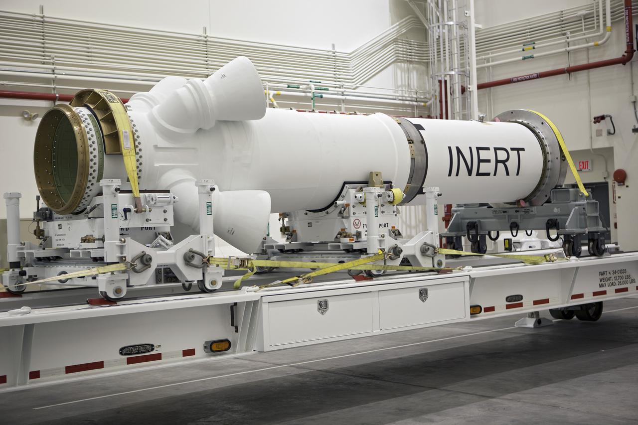 CAPE CANAVERAL, Fla. – At NASA’s Kennedy Space Center in Florida, members of the media viewed the Alliant Techsystems, or ATK, launch abort motor inside the Launch Abort System Facility. ATK’s abort motor is one of the components of Orion’s Launch Abort System, which will be used for Exploration Flight Test 1, or EFT-1. The system is designed to safely pull the Orion crew module away from the launch vehicle in the event of an emergency on the launch pad or during the initial ascent of NASA’s Space Launch System, or SLS, rocket. The test flight abort motor is configured with inert propellant.  Orion is the exploration spacecraft designed to carry crews to space beyond low Earth orbit. It will provide emergency abort capability, sustain the crew during the space travel and provide safe re-entry from deep space return velocities. Orion’s first unpiloted test flight is scheduled to launch in 2014 atop a Delta IV rocket. A second uncrewed flight test is scheduled for 2017 on the SLS rocket. For more information, visit http:__www.nasa.gov_orion. Photo credit: NASA_Dimitri Gerondidakis