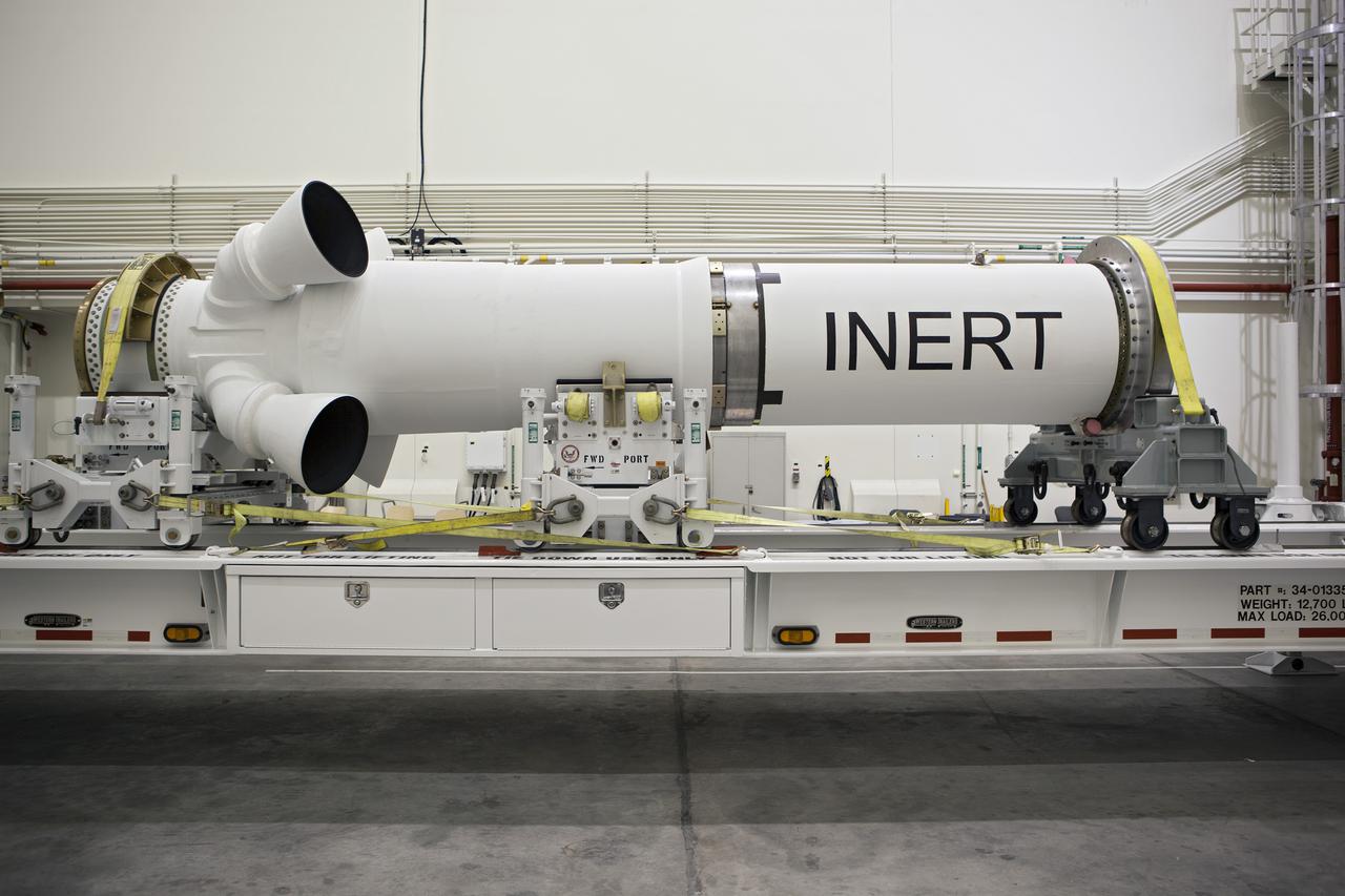 CAPE CANAVERAL, Fla. – At NASA’s Kennedy Space Center in Florida, members of the media viewed the Alliant Techsystems, or ATK, launch abort motor inside the Launch Abort System Facility. ATK’s abort motor is one of the components of Orion’s Launch Abort System, which will be used for Exploration Flight Test 1, or EFT-1. The system is designed to safely pull the Orion crew module away from the launch vehicle in the event of an emergency on the launch pad or during the initial ascent of NASA’s Space Launch System, or SLS, rocket. The test flight abort motor is configured with inert propellant.  Orion is the exploration spacecraft designed to carry crews to space beyond low Earth orbit. It will provide emergency abort capability, sustain the crew during the space travel and provide safe re-entry from deep space return velocities. Orion’s first unpiloted test flight is scheduled to launch in 2014 atop a Delta IV rocket. A second uncrewed flight test is scheduled for 2017 on the SLS rocket. For more information, visit http:__www.nasa.gov_orion. Photo credit: NASA_Dimitri Gerondidakis