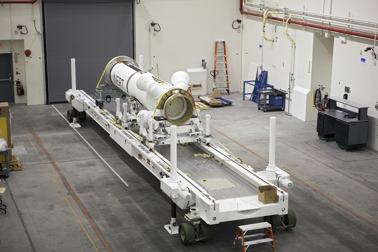 CAPE CANAVERAL, Fla. – At NASA’s Kennedy Space Center in Florida, members of the media viewed the Alliant Techsystems, or ATK, launch abort motor inside the Launch Abort System Facility. ATK’s abort motor is one of the components of Orion’s Launch Abort System, which will be used for Exploration Flight Test 1, or EFT-1. The system is designed to safely pull the Orion crew module away from the launch vehicle in the event of an emergency on the launch pad or during the initial ascent of NASA’s Space Launch System, or SLS, rocket. The test flight abort motor is configured with inert propellant.  Orion is the exploration spacecraft designed to carry crews to space beyond low Earth orbit. It will provide emergency abort capability, sustain the crew during the space travel and provide safe re-entry from deep space return velocities. Orion’s first unpiloted test flight is scheduled to launch in 2014 atop a Delta IV rocket. A second uncrewed flight test is scheduled for 2017 on the SLS rocket. For more information, visit http:__www.nasa.gov_orion. Photo credit: NASA_Dimitri Gerondidakis