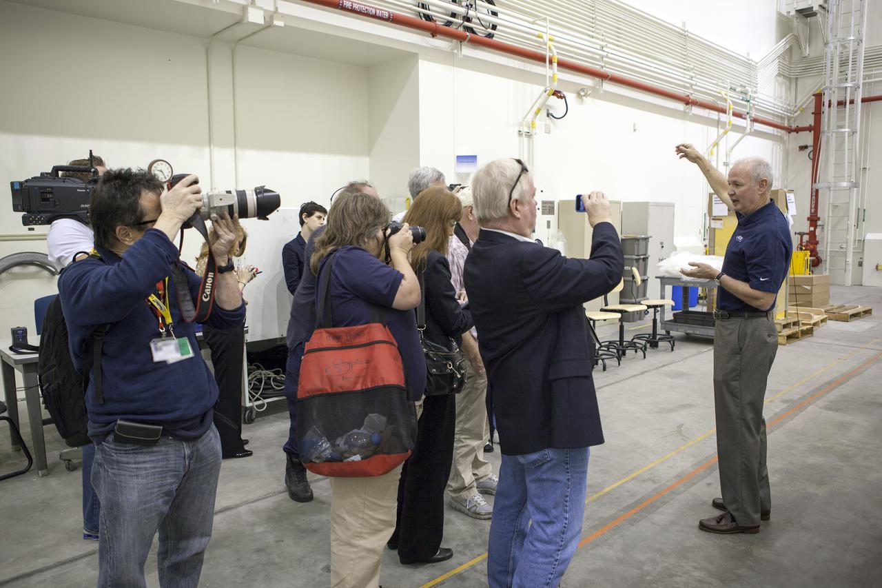 CAPE CANAVERAL, Fla. – At NASA’s Kennedy Space Center in Florida, Brian Duffy, the vice president and Johnson Space Center manager for Exploration Systems with ATK Aerospace Systems, talks with members of the media during a viewing of ATK’s launch abort motor inside the Launch Abort System Facility. The abort motor is one of the components of Orion’s Launch Abort System, which will be used for Exploration Flight Test 1, or EFT-1. The system is designed to safely pull the Orion crew module away from the launch vehicle in the event of an emergency on the launch pad or during the initial ascent of NASA’s Space Launch System, or SLS, rocket. The test flight abort motor is configured with inert propellant.   Orion is the exploration spacecraft designed to carry crews to space beyond low Earth orbit. It will provide emergency abort capability, sustain the crew during the space travel and provide safe re-entry from deep space return velocities. Orion’s first unpiloted test flight is scheduled to launch in 2014 atop a Delta IV rocket. A second uncrewed flight test is scheduled for 2017 on the SLS rocket. For more information, visit http:__www.nasa.gov_orion. Photo credit: NASA_Dimitri Gerondidakis