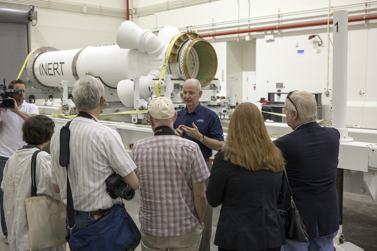 CAPE CANAVERAL, Fla. – At NASA’s Kennedy Space Center in Florida, Brian Duffy, the vice president and Johnson Space Center manager for Exploration Systems with ATK Aerospace Systems, talks with members of the media during a viewing of ATK’s launch abort motor inside the Launch Abort System Facility. The abort motor is one of the components of Orion’s Launch Abort System, which will be used for Exploration Flight Test 1, or EFT-1. The system is designed to safely pull the Orion crew module away from the launch vehicle in the event of an emergency on the launch pad or during the initial ascent of NASA’s Space Launch System, or SLS, rocket. The test flight abort motor is configured with inert propellant.   Orion is the exploration spacecraft designed to carry crews to space beyond low Earth orbit. It will provide emergency abort capability, sustain the crew during the space travel and provide safe re-entry from deep space return velocities. Orion’s first unpiloted test flight is scheduled to launch in 2014 atop a Delta IV rocket. A second uncrewed flight test is scheduled for 2017 on the SLS rocket. For more information, visit http:__www.nasa.gov_orion. Photo credit: NASA_Dimitri Gerondidakis
