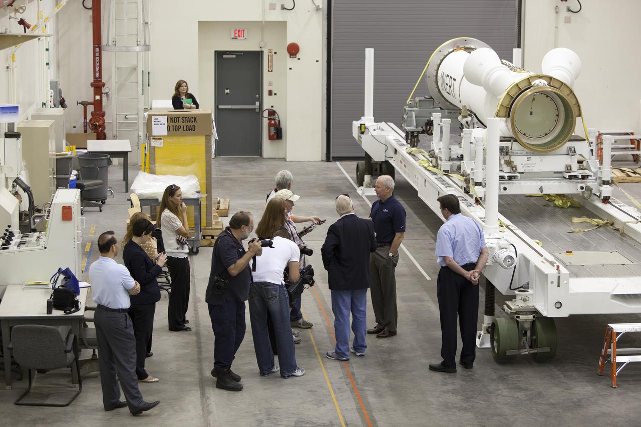 CAPE CANAVERAL, Fla. – At NASA’s Kennedy Space Center in Florida, Brian Duffy, the vice president and Johnson Space Center manager for Exploration Systems with ATK Aerospace Systems, talks with members of the media during a viewing of ATK’s launch abort motor inside the Launch Abort System Facility. The abort motor is one of the components of Orion’s Launch Abort System, which will be used for Exploration Flight Test 1, or EFT-1. The system is designed to safely pull the Orion crew module away from the launch vehicle in the event of an emergency on the launch pad or during the initial ascent of NASA’s Space Launch System, or SLS, rocket. The test flight abort motor is configured with inert propellant.   Orion is the exploration spacecraft designed to carry crews to space beyond low Earth orbit. It will provide emergency abort capability, sustain the crew during the space travel and provide safe re-entry from deep space return velocities. Orion’s first unpiloted test flight is scheduled to launch in 2014 atop a Delta IV rocket. A second uncrewed flight test is scheduled for 2017 on the SLS rocket. For more information, visit http:__www.nasa.gov_orion. Photo credit: NASA_Dimitri Gerondidakis