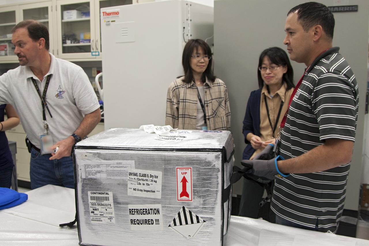 CAPE CANAVERAL, Fla. - In the Space Station Processing Facility at NASA's Kennedy Space Center in Florida, engineers prepare to load experiments requiring low temperatures into the General Laboratory Active Cryogenic International Space Station ISS Experiment Refrigerator, or GLACIER. The samples will then be transported to Space Launch Complex-40 on Cape Canaveral Air Force Station where the GLACIER will be loaded aboard the SpaceX Dragon capsule.  Scheduled for launch on March 1 atop a Falcon 9 rocket, Dragon will be marking its third trip to the space station. The mission is the second of 12 SpaceX flights contracted by NASA to resupply the orbiting laboratory. For more information, visit http:__www.nasa.gov_mission_pages_station_structure_launch_spacex2-feature.html Photo credit: NASA_Kim Shiflett
