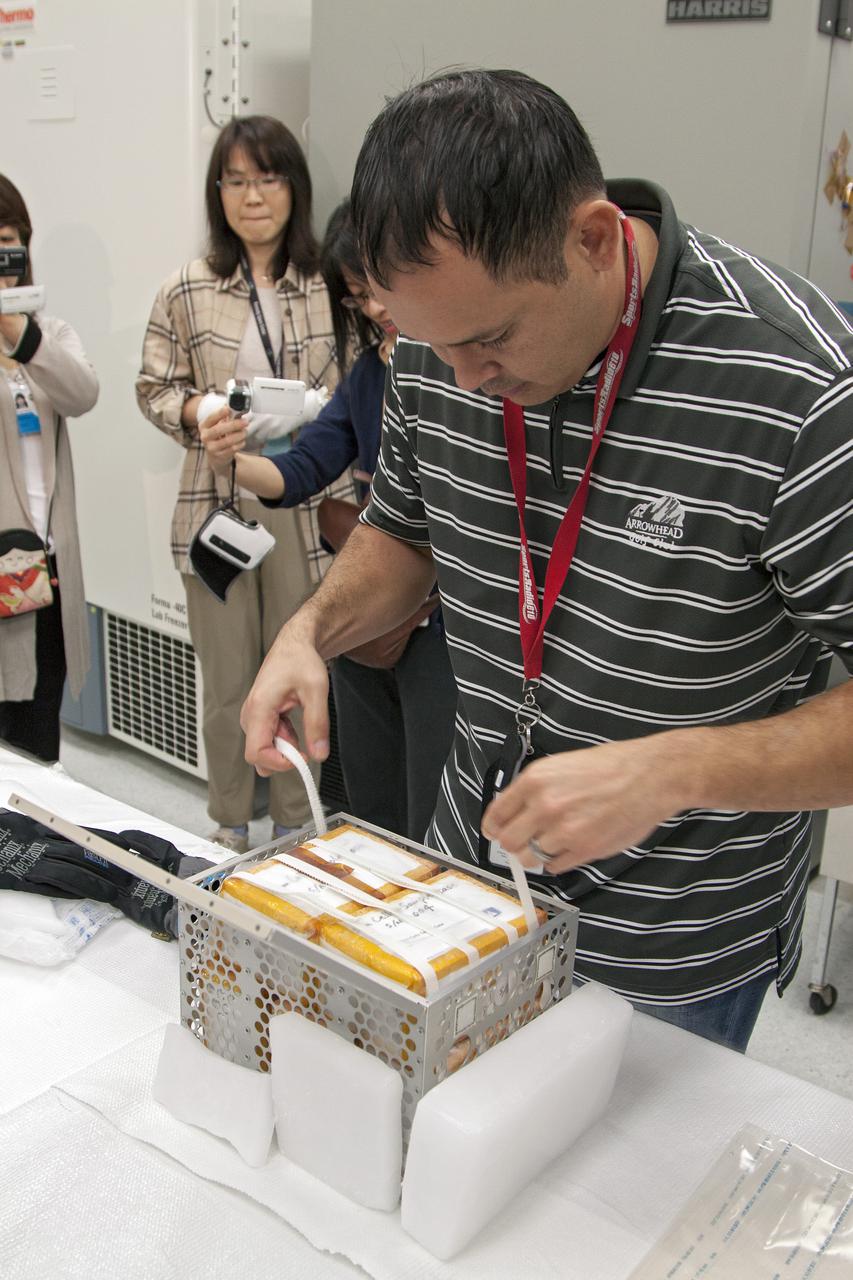 CAPE CANAVERAL, Fla. - In the Space Station Processing Facility at NASA's Kennedy Space Center in Florida, engineers prepare to load experiments requiring low temperatures into the General Laboratory Active Cryogenic International Space Station ISS Experiment Refrigerator, or GLACIER. The samples will then be transported to Space Launch Complex-40 on Cape Canaveral Air Force Station where the GLACIER will be loaded aboard the SpaceX Dragon capsule.  Scheduled for launch on March 1 atop a Falcon 9 rocket, Dragon will be marking its third trip to the space station. The mission is the second of 12 SpaceX flights contracted by NASA to resupply the orbiting laboratory. For more information, visit http:__www.nasa.gov_mission_pages_station_structure_launch_spacex2-feature.html Photo credit: NASA_Kim Shiflett