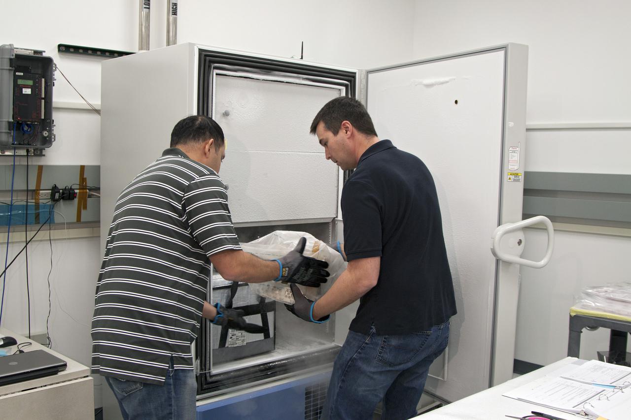 CAPE CANAVERAL, Fla. - In the Space Station Processing Facility at NASA's Kennedy Space Center in Florida, engineers prepare to load experiments requiring low temperatures into the General Laboratory Active Cryogenic International Space Station ISS Experiment Refrigerator, or GLACIER. The samples will then be transported to Space Launch Complex-40 on Cape Canaveral Air Force Station where the GLACIER will be loaded aboard the SpaceX Dragon capsule.  Scheduled for launch on March 1 atop a Falcon 9 rocket, Dragon will be marking its third trip to the space station. The mission is the second of 12 SpaceX flights contracted by NASA to resupply the orbiting laboratory. For more information, visit http:__www.nasa.gov_mission_pages_station_structure_launch_spacex2-feature.html Photo credit: NASA_Kim Shiflett
