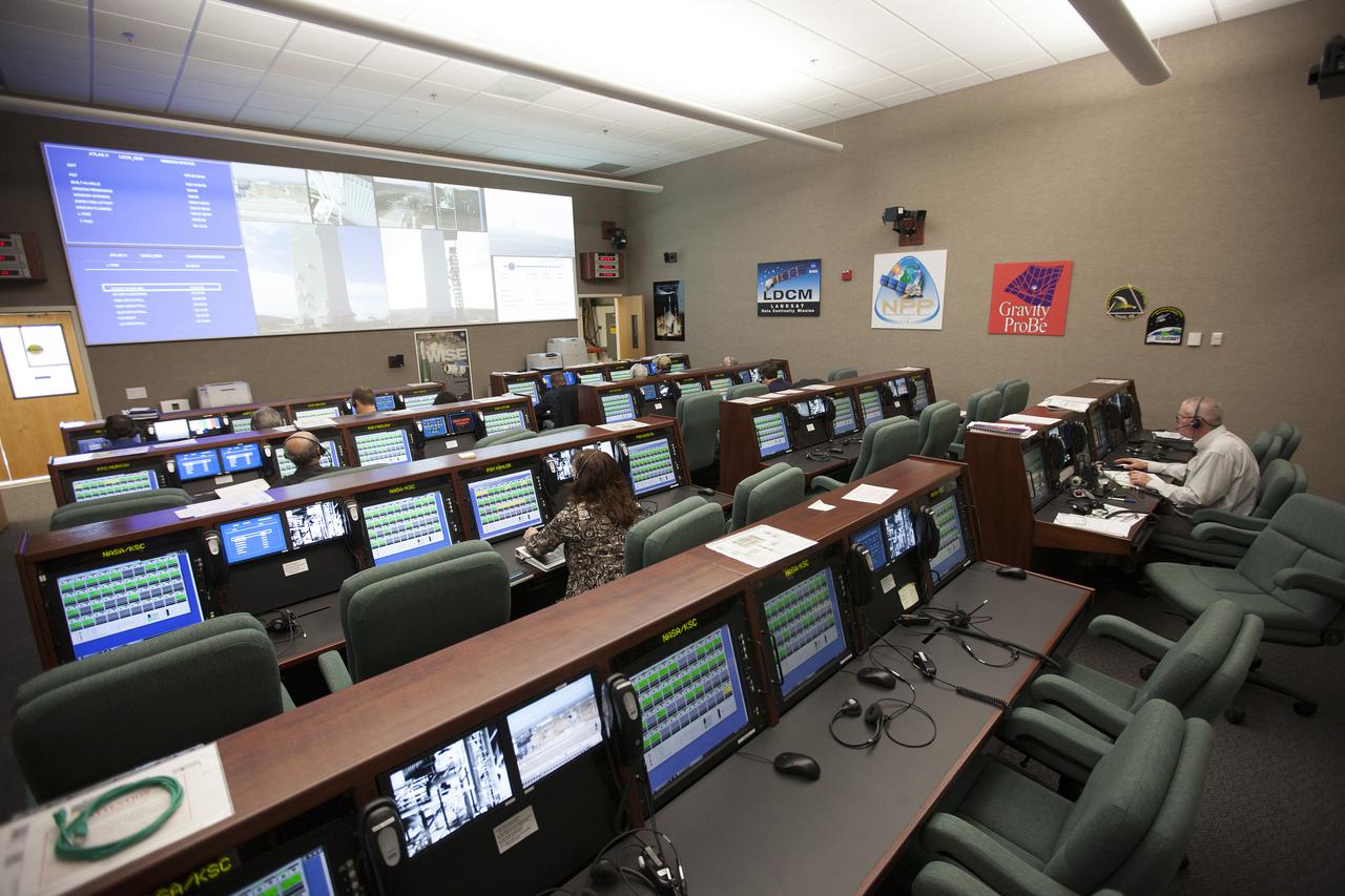 VANDENBERG AFB, Calif. -- From their consoles in the Mission Director's Center at Vandenberg Air Force Base, launch controllers monitor the countdown for a United Launch Alliance Atlas V with the Landsat Data Continuity Mission, or LDCM, satellite prior to liftoff. The Landsat Data Continuity Mission, or LDCM, is the future of Landsat satellites. It will continue to obtain valuable data and imagery to be used in agriculture, education, business, science, and government. The Landsat Program provides repetitive acquisition of high resolution multispectral data of the Earth's surface on a global basis. The data from the Landsat spacecraft constitute the longest record of the Earth's continental surfaces as seen from space. It is a record unmatched in quality, detail, coverage, and value. Liftoff is planned for Feb. 11, 2013 aboard a United Launch Alliance Atlas V rocket. For more information, visit: http:__www.nasa.gov_mission_pages_landsat_main_index.html Photo credit: NASA_ Kim Shiflett