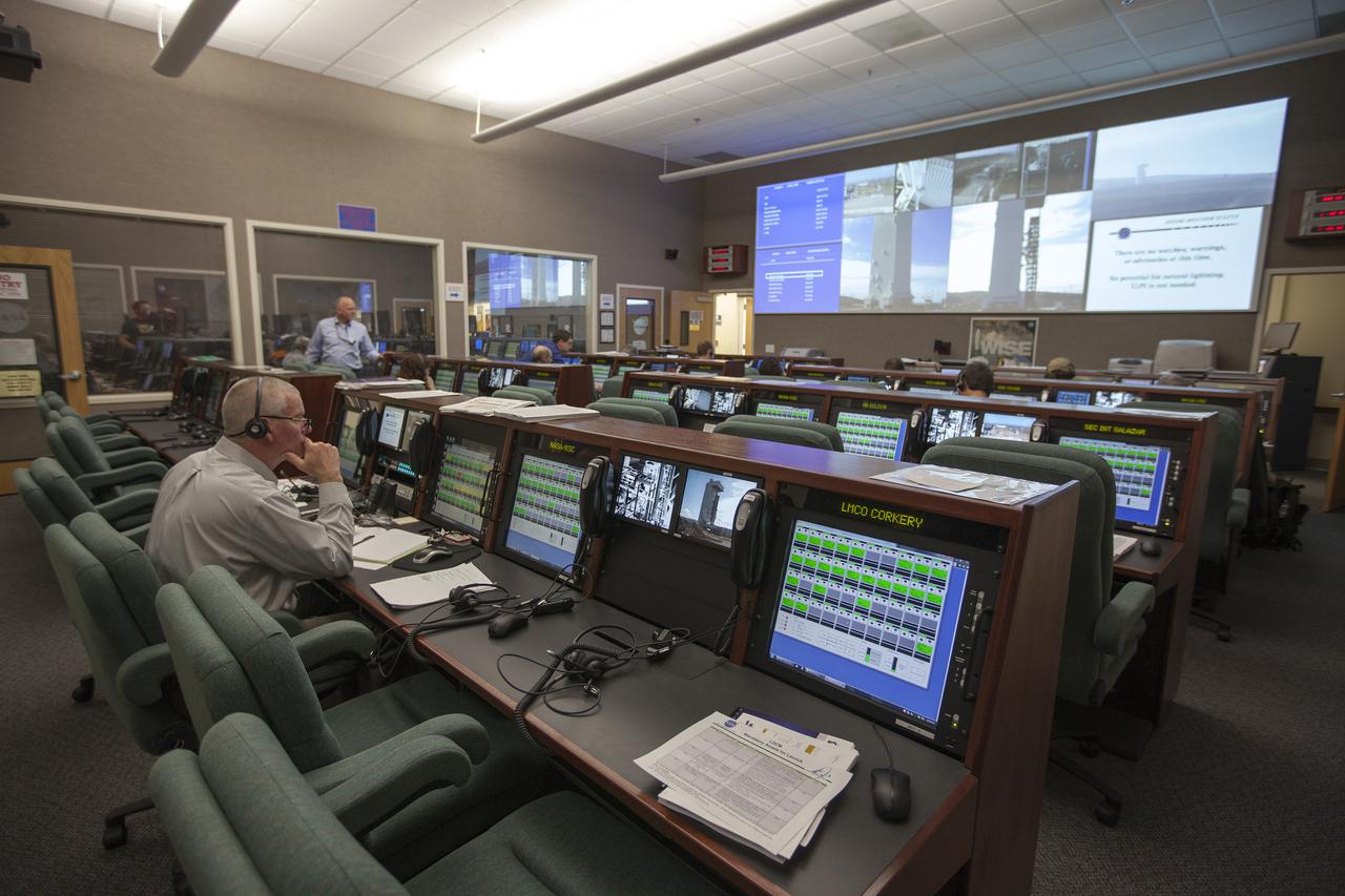 VANDENBERG AFB, Calif. -- From their consoles in the Mission Director's Center at Vandenberg Air Force Base, launch controllers monitor the countdown for a United Launch Alliance Atlas V with the Landsat Data Continuity Mission, or LDCM, satellite prior to liftoff. The Landsat Data Continuity Mission, or LDCM, is the future of Landsat satellites. It will continue to obtain valuable data and imagery to be used in agriculture, education, business, science, and government. The Landsat Program provides repetitive acquisition of high resolution multispectral data of the Earth's surface on a global basis. The data from the Landsat spacecraft constitute the longest record of the Earth's continental surfaces as seen from space. It is a record unmatched in quality, detail, coverage, and value. Liftoff is planned for Feb. 11, 2013 aboard a United Launch Alliance Atlas V rocket. For more information, visit: http:__www.nasa.gov_mission_pages_landsat_main_index.html Photo credit: NASA_ Kim Shiflett