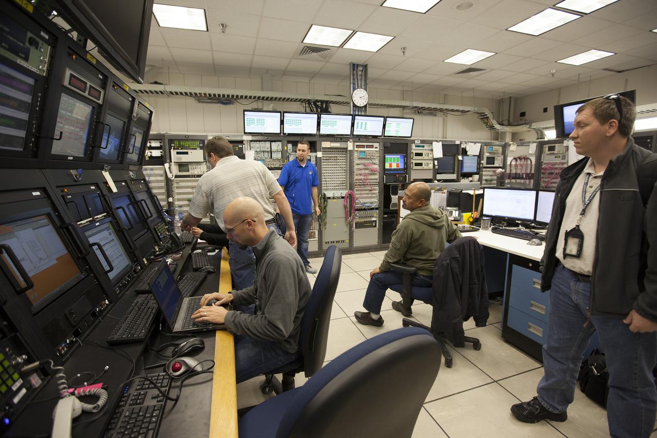 VANDENBERG AFB, Calif. -- From their positions in the telemetry laboratory at Vandenberg Air Force Base, engineers and technicians monitor the countdown for a United Launch Alliance Atlas V with the Landsat Data Continuity Mission, or LDCM, satellite prior to liftoff. The Landsat Data Continuity Mission, or LDCM, is the future of Landsat satellites. It will continue to obtain valuable data and imagery to be used in agriculture, education, business, science, and government. The Landsat Program provides repetitive acquisition of high resolution multispectral data of the Earth's surface on a global basis. The data from the Landsat spacecraft constitute the longest record of the Earth's continental surfaces as seen from space. It is a record unmatched in quality, detail, coverage, and value. Liftoff is planned for Feb. 11, 2013 aboard a United Launch Alliance Atlas V rocket. For more information, visit: http:__www.nasa.gov_mission_pages_landsat_main_index.html Photo credit: NASA_ Kim Shiflett