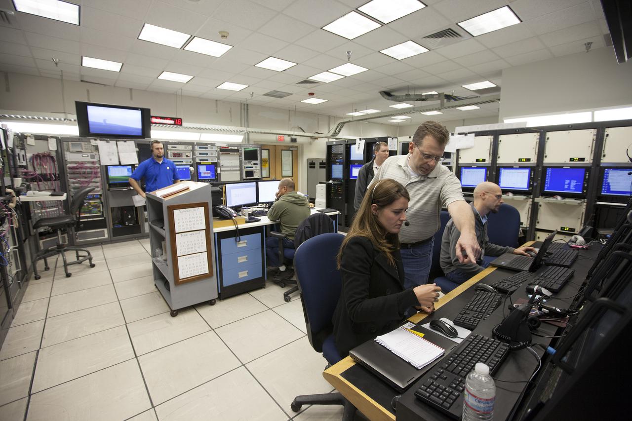 VANDENBERG AFB, Calif. -- From their positions in the telemetry laboratory at Vandenberg Air Force Base, engineers and technicians monitor the countdown for a United Launch Alliance Atlas V with the Landsat Data Continuity Mission, or LDCM, satellite prior to liftoff. The Landsat Data Continuity Mission, or LDCM, is the future of Landsat satellites. It will continue to obtain valuable data and imagery to be used in agriculture, education, business, science, and government. The Landsat Program provides repetitive acquisition of high resolution multispectral data of the Earth's surface on a global basis. The data from the Landsat spacecraft constitute the longest record of the Earth's continental surfaces as seen from space. It is a record unmatched in quality, detail, coverage, and value. Liftoff is planned for Feb. 11, 2013 aboard a United Launch Alliance Atlas V rocket. For more information, visit: http:__www.nasa.gov_mission_pages_landsat_main_index.html Photo credit: NASA_ Kim Shiflett