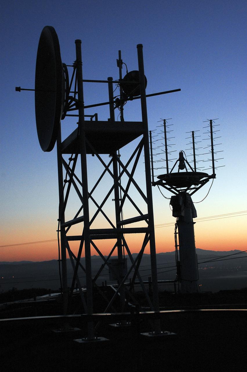 VANDENBERG AFB, Calif. – Tracking equipment and antennas show in silhouette as the sun rises over a United Launch Alliance Atlas V rocket carrying the Landsat Data Continuity Mission spacecraft from Vandenberg Air Force Base in California. Photo credit: NASA_Ben Smegelsky