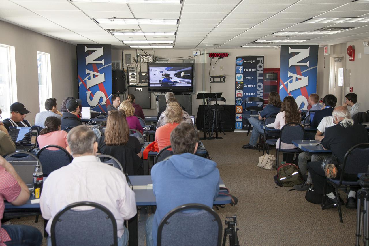 CAPE CANAVERAL, Fla. - At NASA Kennedy Space Center’s Press Site annex building in Florida, social media followers watch a movie titled, “Building Momentum,” during NASA Social media activities focused on the SpaceX 2 Commercial Resupply Mission to the International Space Station.  Liftoff of the SpaceX Falcon 9 rocket and Dragon spacecraft is planned for March 1, 2013, at 10:10 a.m. EST, from Space Launch Complex-40 at Cape Canaveral Air Force Station, Fla. Dragon will be making its third trip to the space station. It will carry supplies and experiments to the orbiting laboratory. The mission is the second of 12 SpaceX flights contracted by NASA to resupply the space station. For more information, visit http:__www.nasa.gov_mission_pages_station_structure_launch_spacex2-feature.html Photo credit: NASA_Frankie Martin