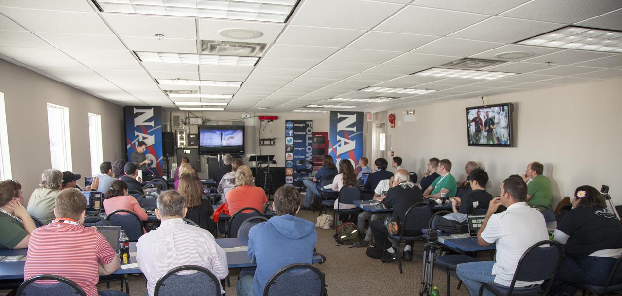 CAPE CANAVERAL, Fla. - At NASA Kennedy Space Center’s Press Site annex building in Florida, social media followers watch a movie titled, “Building Momentum,” during NASA Social media activities focused on the SpaceX 2 Commercial Resupply Mission to the International Space Station.  Liftoff of the SpaceX Falcon 9 rocket and Dragon spacecraft is planned for March 1, 2013, at 10:10 a.m. EST, from Space Launch Complex-40 at Cape Canaveral Air Force Station, Fla. Dragon will be making its third trip to the space station. It will carry supplies and experiments to the orbiting laboratory. The mission is the second of 12 SpaceX flights contracted by NASA to resupply the space station. For more information, visit http:__www.nasa.gov_mission_pages_station_structure_launch_spacex2-feature.html Photo credit: NASA_Frankie Martin