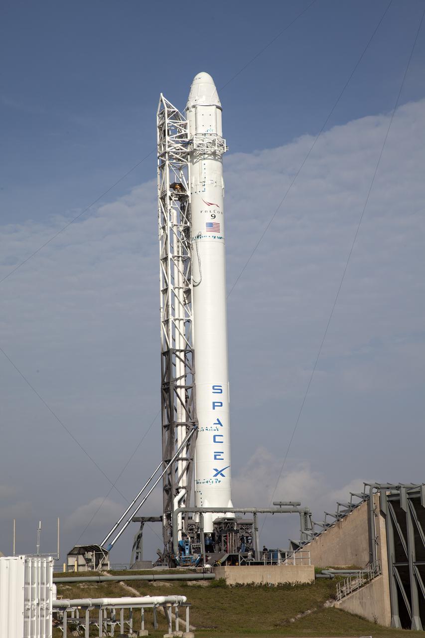 CAPE CANAVERAL, Fla. - At Cape Canaveral Air Force Station in Florida, the SpaceX Falcon 9 rocket has been raised to vertical on the launch pad at Launch Complex 40, awaiting a test firing of the vehicle's nine Merlin first-stage engines. The test is part of prelaunch preparations for the upcoming SpaceX 2 mission.   Liftoff of the SpaceX Falcon 9 rocket and Dragon spacecraft is planned for March 1, 2013, at 10:10 a.m. EST, from Space Launch Complex-40 at Cape Canaveral Air Force Station, Fla. Dragon will be making its third trip to the space station. It will carry supplies and experiments to the orbiting laboratory. The mission is the second of 12 SpaceX flights contracted by NASA to resupply the space station. For more information, visit http:__www.nasa.gov_mission_pages_station_structure_launch_spacex2-feature.html Photo credit: NASA_Frankie Martin