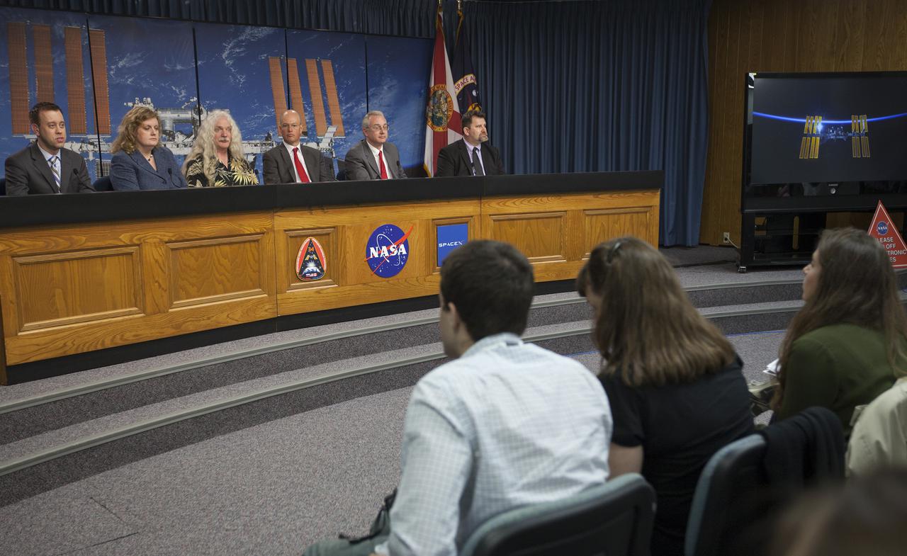 CAPE CANAVERAL, Fla. - Media attending a pre-launch news conference at the Kennedy Space Center, Fla. heard from officials who discussed payloads to be launched aboard a SpaceX Dragon capsule. From the left are: Josh Byerly of NASA Public Affairs at the Johnson Space Center, Julie Robinson, NASA program scientist for the International Space Station, Simon Gilroy, Ph.D., BRIC-17 Lead Investigator from the University of Wisconsin, Marshall Porterfield, division director of the Life and Physical Sciences at NASA Headquarters, Michael Johnson, chief technical officer for NanoRacks, and Michael Roberts, research scientist with the Center for Advancement of Science in Space.   Scheduled for launch March 1 atop a Falcon 9 rocket, the SpaceX Dragon capsule will be making its third trip to the space station. The mission is the second of 12 SpaceX flights contracted by NASA to resupply the orbiting laboratory. For more information, visit http:__www.nasa.gov_mission_pages_station_structure_launch_spacex2-feature.html Photo credit: NASA_Kim Shiflett