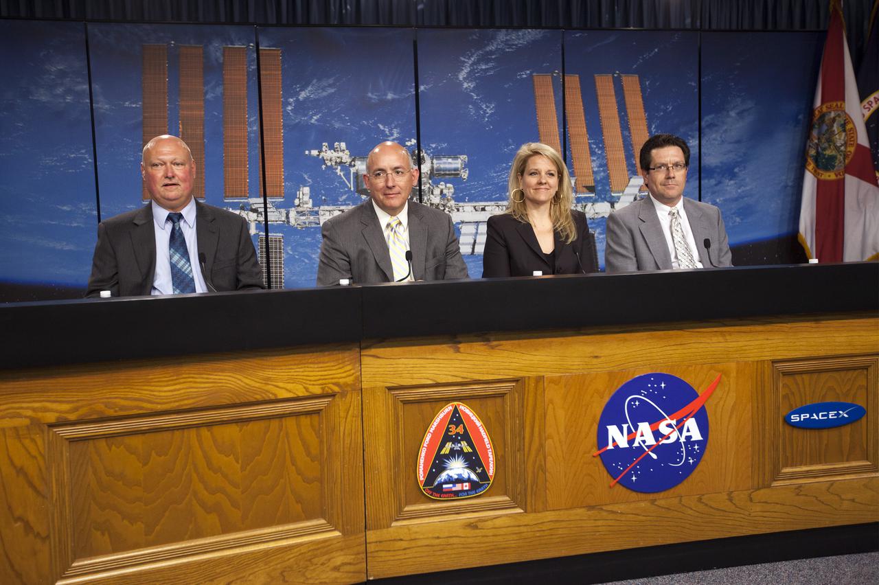 CAPE CANAVERAL, Fla. - Media attending a pre-launch news conference at the Kennedy Space Center, Fla. heard from officials who discussed payloads to be launched aboard a SpaceX Dragon capsule. From the left are: Mike Curie of NASA Public Affairs at the Kennedy Space Center, Mike Suffredini, NASA program manager for the International Space Station at the Johnson Space Center, Gwynne Shotwell, president of SpaceX, and Joel Tumbiolo, launch weather officer for the 45th Weather Squadron at Cape Canaveral Air Force Station. Scheduled for launch March 1 atop a Falcon 9 rocket, the SpaceX Dragon capsule will be making its third trip to the space station. The mission is the second of 12 SpaceX flights contracted by NASA to resupply the orbiting laboratory. For more information, visit http:__www.nasa.gov_mission_pages_station_structure_launch_spacex2-feature.html Photo credit: NASA_Kim Shiflett