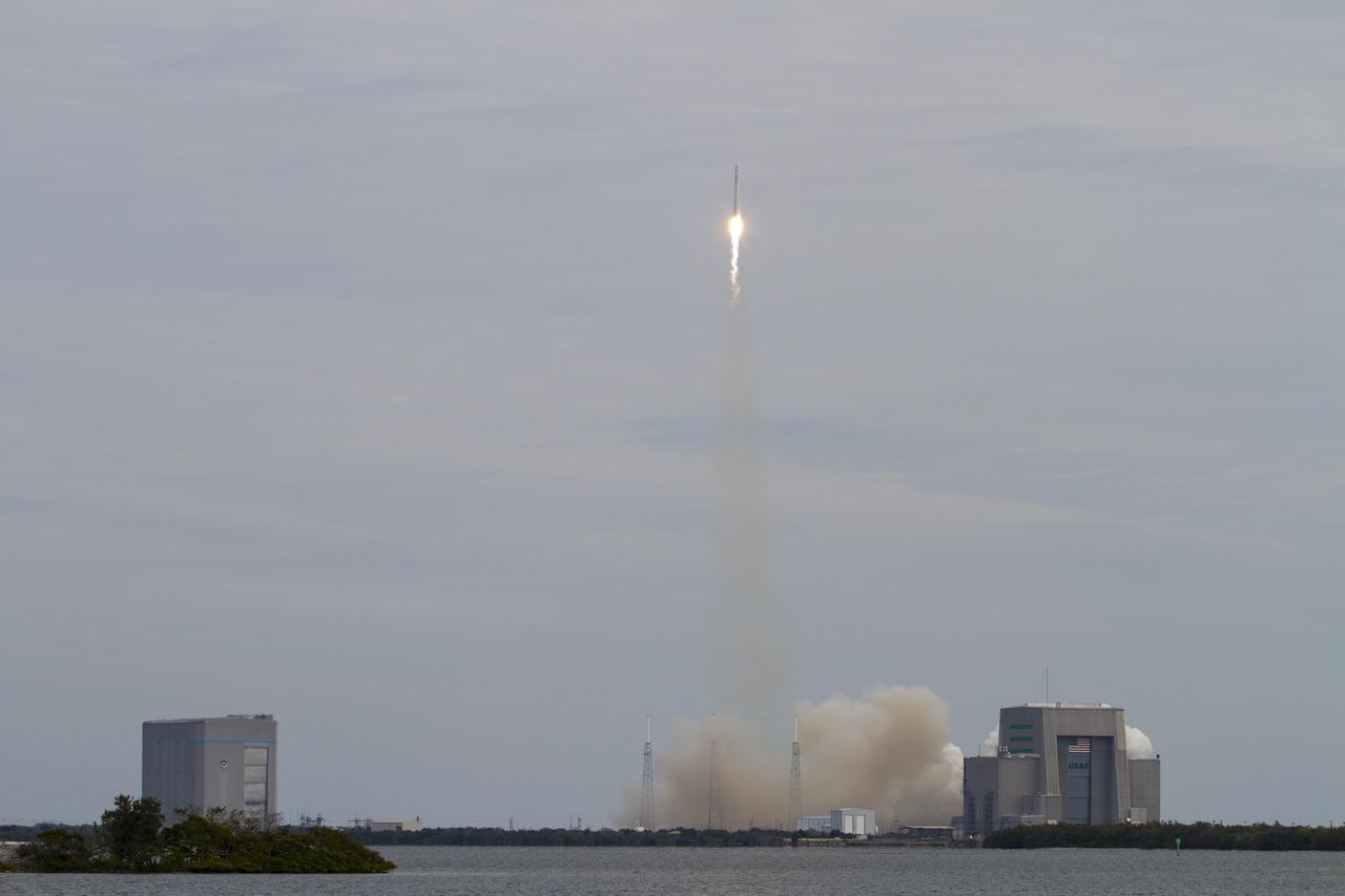CAPE CANAVERAL, Fla. -- A Space Exploration Technologies, or SpaceX, Falcon 9 rocket lifts off Space Launch Complex 40 on Cape Canaveral Air Force Station in Florida at 10:10 a.m. EST, carrying a Dragon capsule filled with cargo to orbit. Left of the pad is the Solid Motor Assembly and Readiness Facility, or SMARF. The Solid Motor Assembly Building, or SMAB, is at right.   The SpaceX Dragon capsule is making its third trip to the International Space Station, following a demonstration flight in May 2012 and the first resupply mission in October 2012. The mission is the second of 12 SpaceX flights contracted by NASA to resupply the orbiting laboratory. For more information, visit http:__www.nasa.gov_mission_pages_station_structure_launch_spacex2-feature.html.  Photo credit: NASA_Bill White