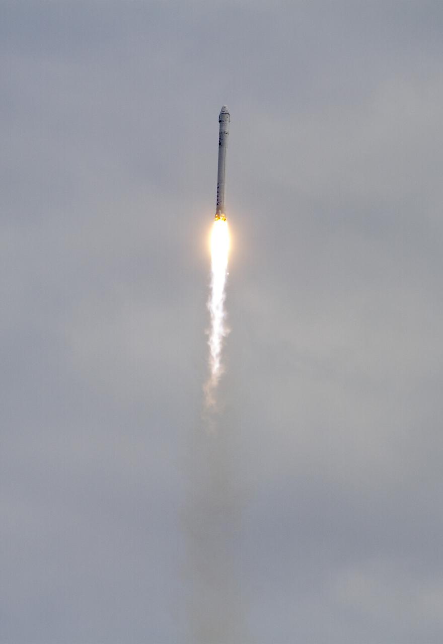CAPE CANAVERAL, Fla. -- A cloudy sky over Space Launch Complex 40 on Cape Canaveral Air Force Station in Florida did not impede the launch of the Space Exploration Technologies, or SpaceX, Falcon 9 rocket carrying a Dragon capsule filled with cargo to orbit. Liftoff was at 10:10 a.m. EST.  The SpaceX Dragon capsule is making its third trip to the International Space Station, following a demonstration flight in May 2012 and the first resupply mission in October 2012. The mission is the second of 12 SpaceX flights contracted by NASA to resupply the orbiting laboratory. For more information, visit http:__www.nasa.gov_mission_pages_station_structure_launch_spacex2-feature.html.  Photo credit: NASA_Bill White