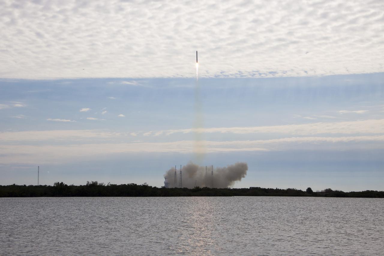 CAPE CANAVERAL, Fla. -- A Space Exploration Technologies, or SpaceX, Falcon 9 rocket roars away from Space Launch Complex 40 toward the dimpled cloud layer over Cape Canaveral Air Force Station in Florida, carrying a Dragon capsule filled with cargo to orbit. Launch was at 10:10 a.m. EST.   The SpaceX Dragon capsule is making its third trip to the International Space Station, following a demonstration flight in May 2012 and the first resupply mission in October 2012. The mission is the second of 12 SpaceX flights contracted by NASA to resupply the orbiting laboratory. For more information, visit http:__www.nasa.gov_mission_pages_station_structure_launch_spacex2-feature.html.  Photo credit: NASA_Jim Grossmann