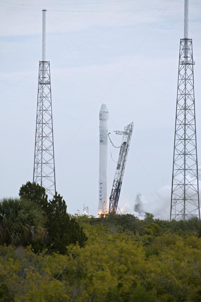 CAPE CANAVERAL, Fla. -- A Space Exploration Technologies, or SpaceX, Falcon 9 rocket lifts off Space Launch Complex 40 on Cape Canaveral Air Force Station in Florida at 10:10 a.m. EST, carrying a Dragon capsule filled with cargo. The SpaceX Dragon capsule is making its third trip to the International Space Station, following a demonstration flight in May 2012 and the first resupply mission in October 2012. The SpaceX-2 mission is the second of 12 SpaceX flights contracted by NASA to resupply the orbiting laboratory. For more information, visit http:__www.nasa.gov_mission_pages_station_structure_launch_spacex2-feature.html Photo credit: NASA_George Roberts