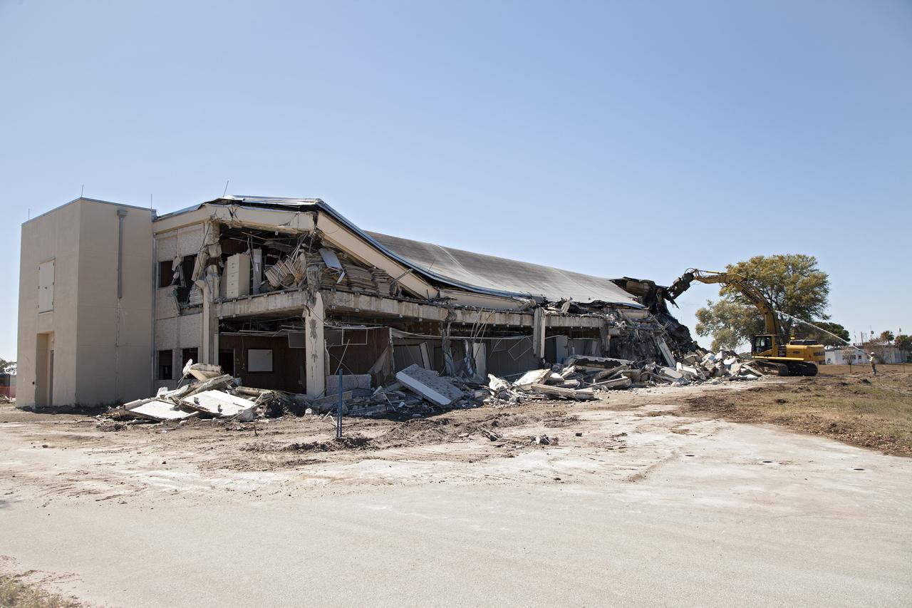 CAPE CANAVERAL, Fla. -- At NASA’s Kennedy Space Center in Florida, demolition is underway on the Base Operations Building, or BOB, in the Industrial Area. The two-story BOB was constructed in 1965 as office space for workers. Kennedy is demolishing some of the older facilities due to their age and to reduce maintenance and repair costs. Photo credit: NASA_Kim Shiflett