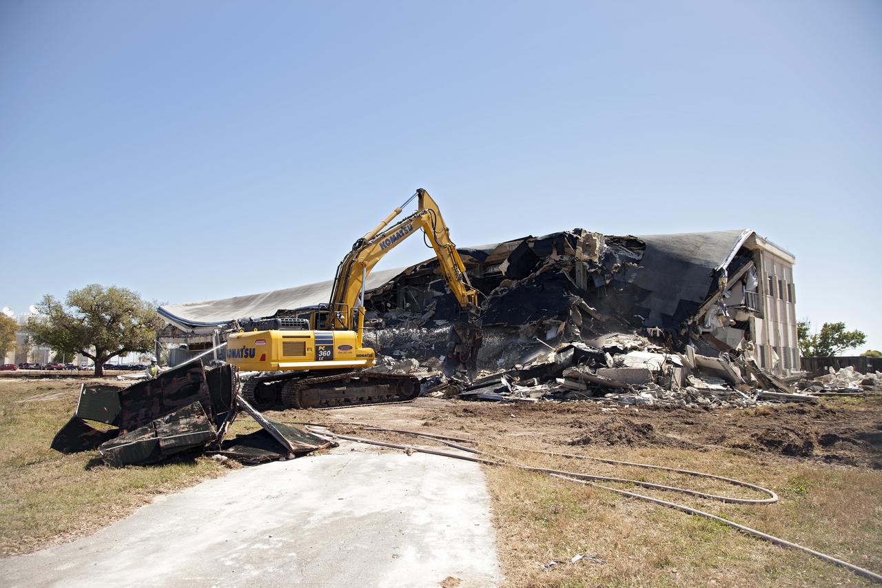 CAPE CANAVERAL, Fla. -- At NASA’s Kennedy Space Center in Florida, demolition is underway on the Base Operations Building, or BOB, in the Industrial Area. The two-story BOB was constructed in 1965 as office space for workers. Kennedy is demolishing some of the older facilities due to their age and to reduce maintenance and repair costs.  Photo credit: NASA_Kim Shiflett