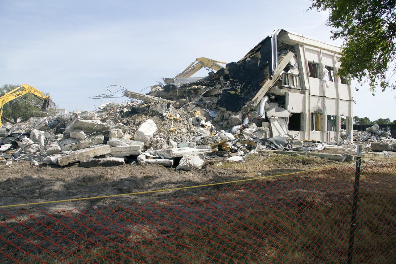 CAPE CANAVERAL, Fla. -- At NASA’s Kennedy Space Center in Florida, demolition is underway on the Base Operations Building, or BOB, in the Industrial Area. The two-story BOB was constructed in 1965 as office space for workers. Kennedy is demolishing some of the older facilities due to their age and to reduce maintenance and repair costs. Photo credit: NASA_ Cory Huston