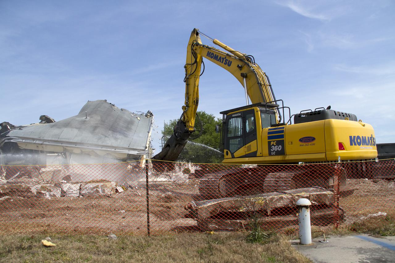 CAPE CANAVERAL, Fla. -- At NASA’s Kennedy Space Center in Florida, demolition is underway on the Base Operations Building, or BOB, in the Industrial Area. The two-story BOB was constructed in 1965 as office space for workers. Kennedy is demolishing some of the older facilities due to their age and to reduce maintenance and repair costs. Photo credit: NASA_ Cory Huston