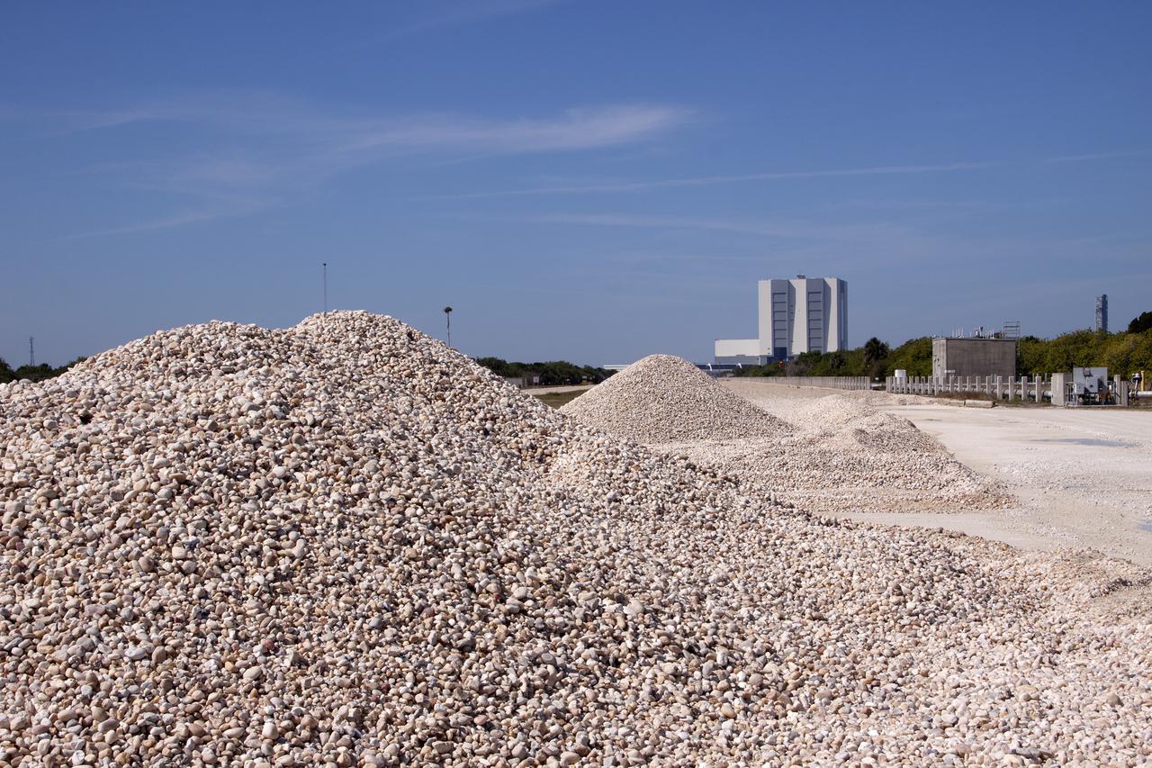 CAPE CANAVERAL, Fla. -- On the crawlerway leading to Launch Pad 39B at NASA’s Kennedy Space Center in Florida, workers from Canaveral Construction in Mims, Fla., continue to remove sections of the Alabama river rock in order to re-grade the lime rock below.   The crawlerway is being upgraded to improve the foundation and prepare it to support the weight of NASA’s Space Launch System, or SLS, and mobile launcher on the crawler-transporter during rollout. Workers are removing the original Alabama river rock and restoring the layer of lime rock below to its original depth. Then new river rock will be added on top. The Ground Systems Development and Operations, or GSDO, Program office at Kennedy is leading the center’s transformation to safely handle a variety of rockets and spacecraft. For more information about GSDO, visit: http:__go.nasa.gov_groundsystems.  Photo credit: NASA_Jim Grossmann