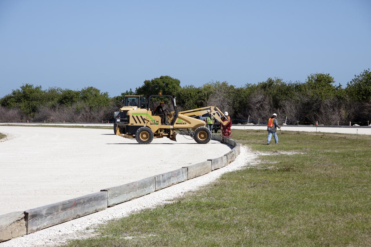 CAPE CANAVERAL, Fla. -- At NASA’s Kennedy Space Center in Florida, workers from Canaveral Construction in Mims, Fla., continue to re-grade the lime rock in sections of the crawlerway leading to Launch Pad 39B.   The crawlerway is being upgraded to improve the foundation and prepare it to support the weight of NASA’s Space Launch System, or SLS, and mobile launcher on the crawler-transporter during rollout. Workers are removing the original Alabama river rock and restoring the layer of lime rock below to its original depth. Then new river rock will be added on top. The Ground Systems Development and Operations, or GSDO, Program office at Kennedy is leading the center’s transformation to safely handle a variety of rockets and spacecraft. For more information about GSDO, visit: http:__go.nasa.gov_groundsystems.  Photo credit: NASA_Jim Grossmann